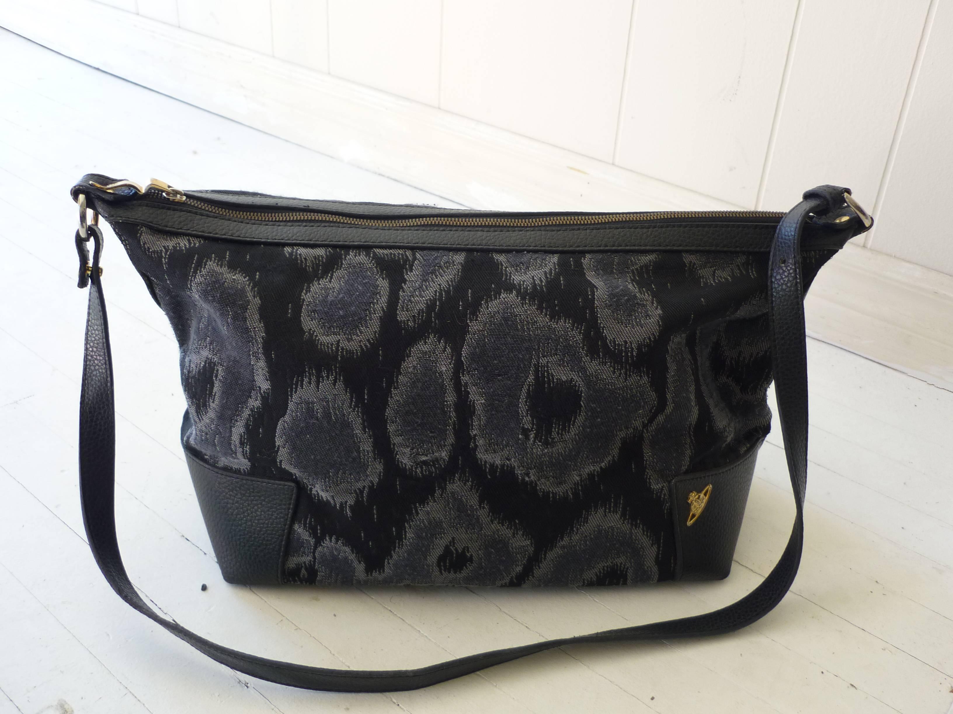 A hobo crossbody and a larger long strap bag, black and grey Toulon print and black and purples Toulon Argyle print. Both have the signature orb logo hardware and zipped inside pockets.

I have declared them in good condition as the smaller bag's