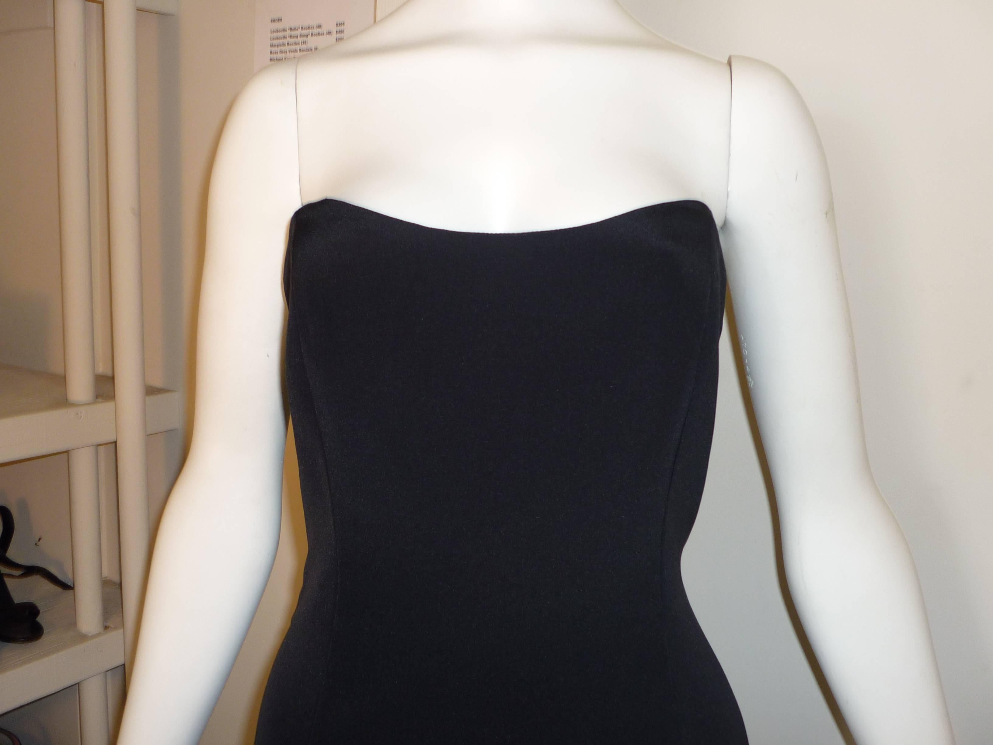 Nice weight silk dress , fully lined in silk, this dress is very well cut and finished with hand stitching.  There is boning to the waist.

The dress is simple and very classy.

Roland Nivelais is a French designer working in the USA.