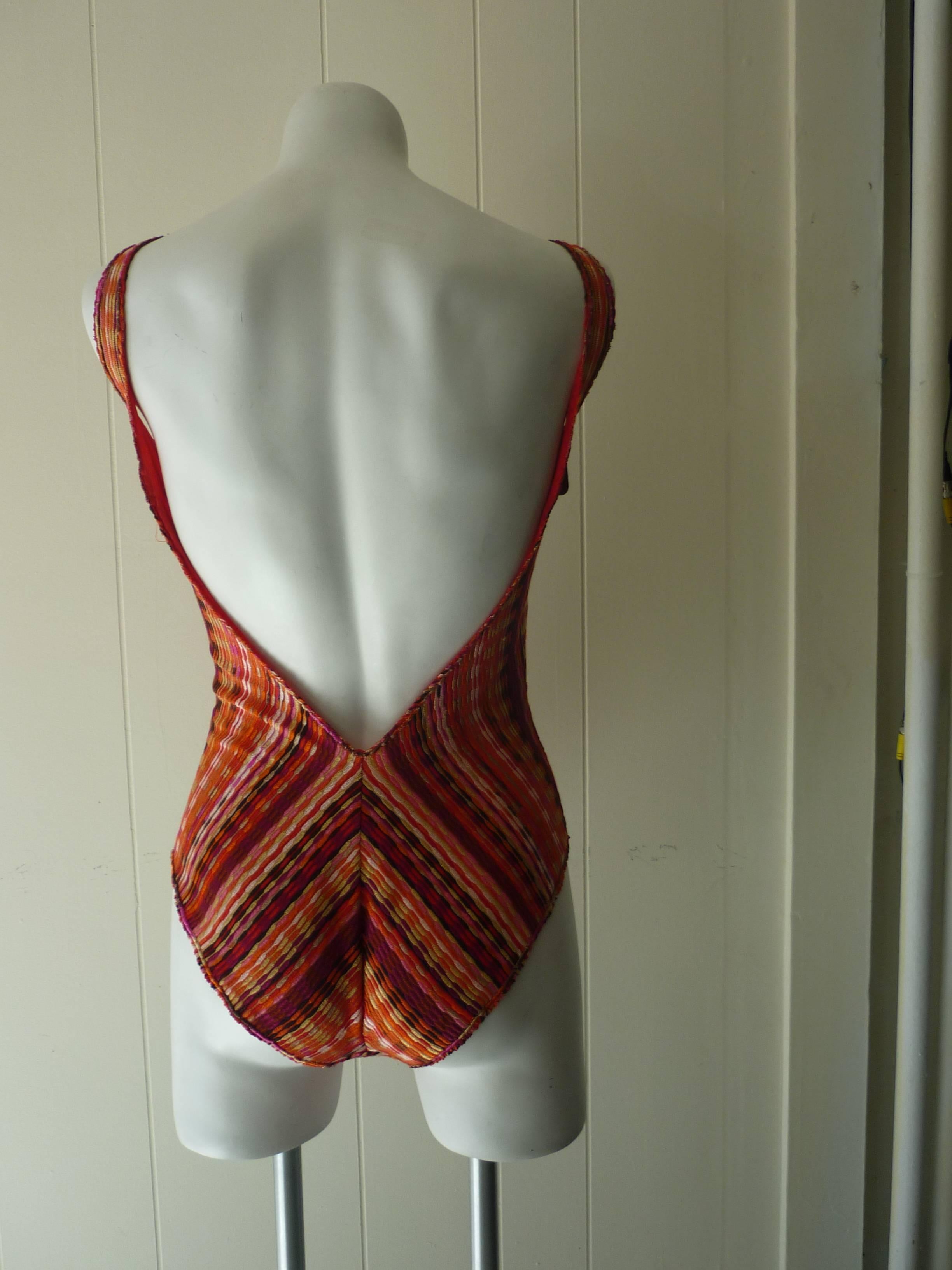 Lovely 55% viscose, 40% cotton and 5% nylon bathing suit with a low scoop back. This item is new with tags.

Bust 34