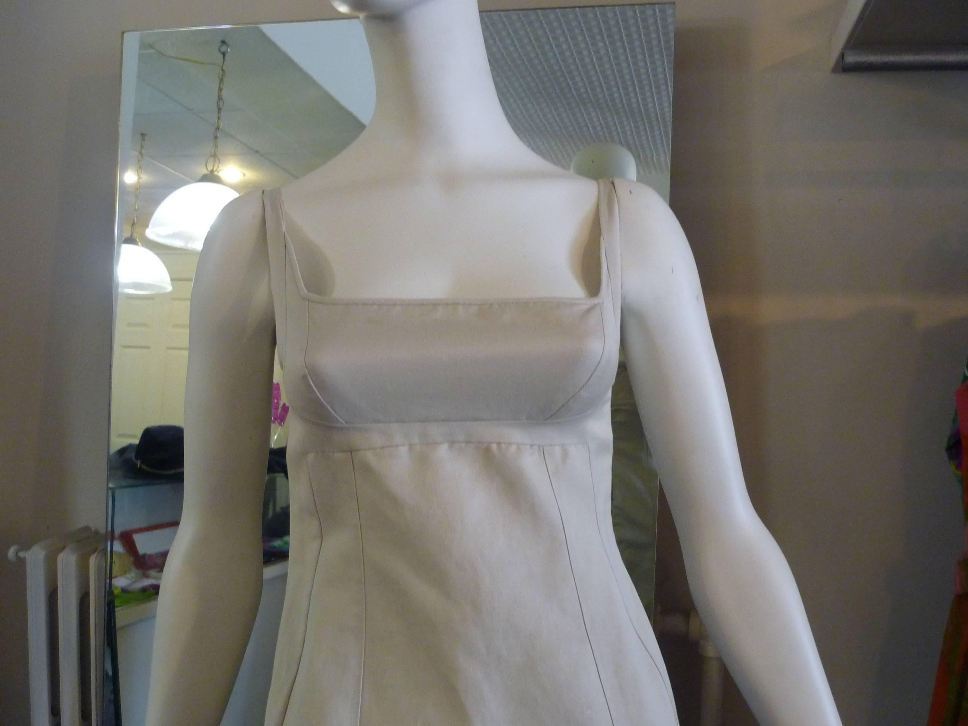Nice simple dress with wonderful seam work inside and out, which is something Narciso Rodriguez is known for.

The back closure is by way of an exposed zipper which runs the lenght of the dress.

The color is a light beige.

The dress is in