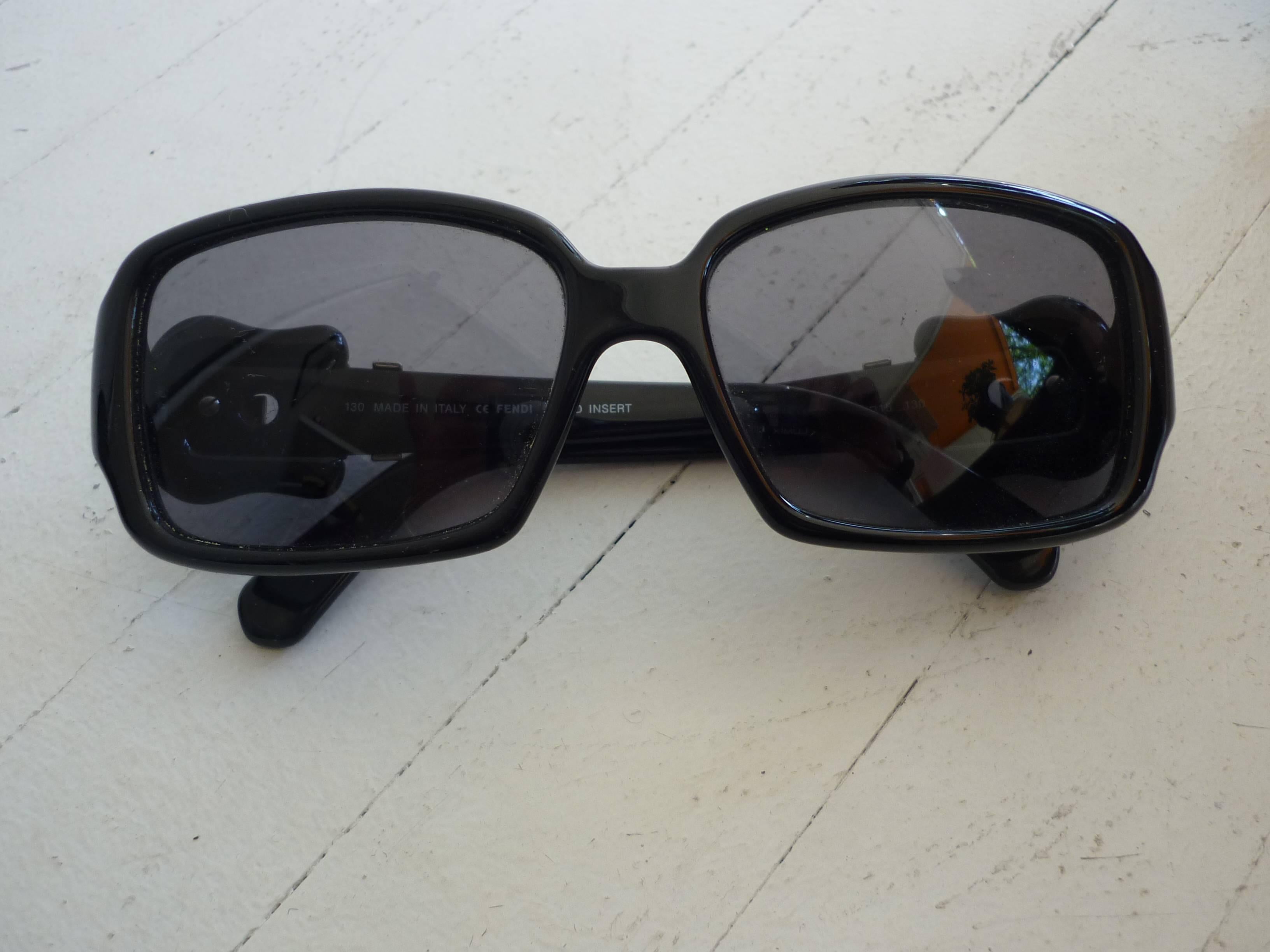 These sunglasses have an unusual belt pattern on the arms with gold embellishments. The frames are plastic and the lenses cold insert.

There are some light scratches on the lenses which is reflected in the price.