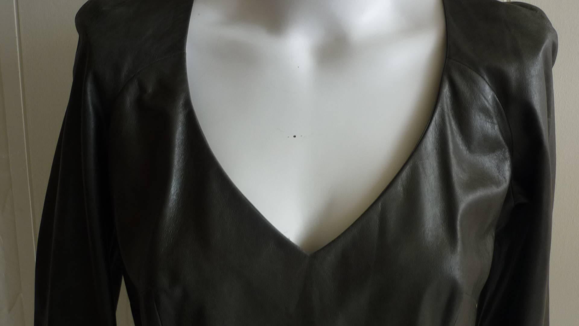Nice supple leather top with side inverted zip, v-neck, and darts.