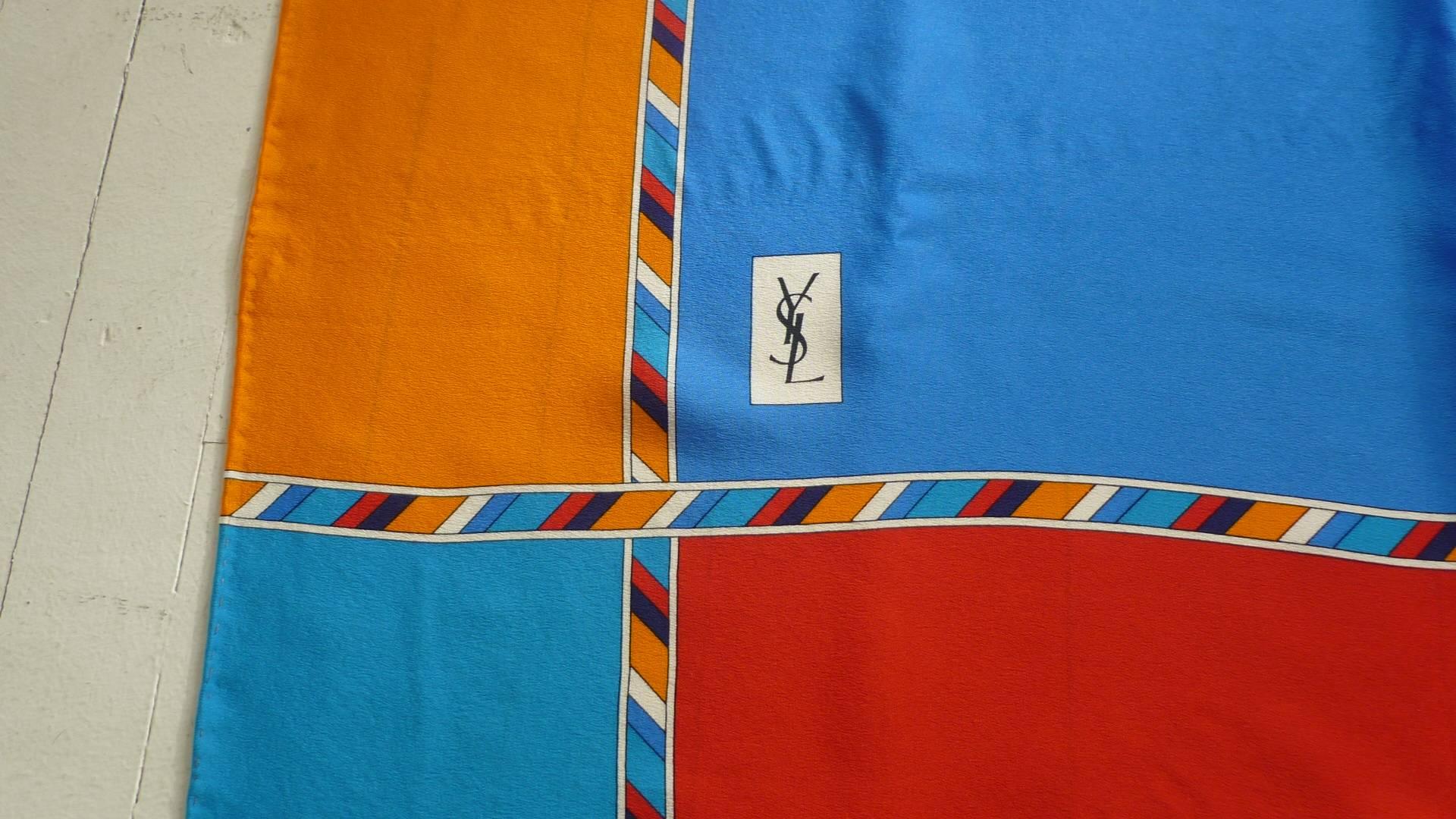 Lovely color combination of red/orange/aqua/blue. This scarf has a few hardly noticeable spots which do not detract from its wearability, and this is reflected in the price.