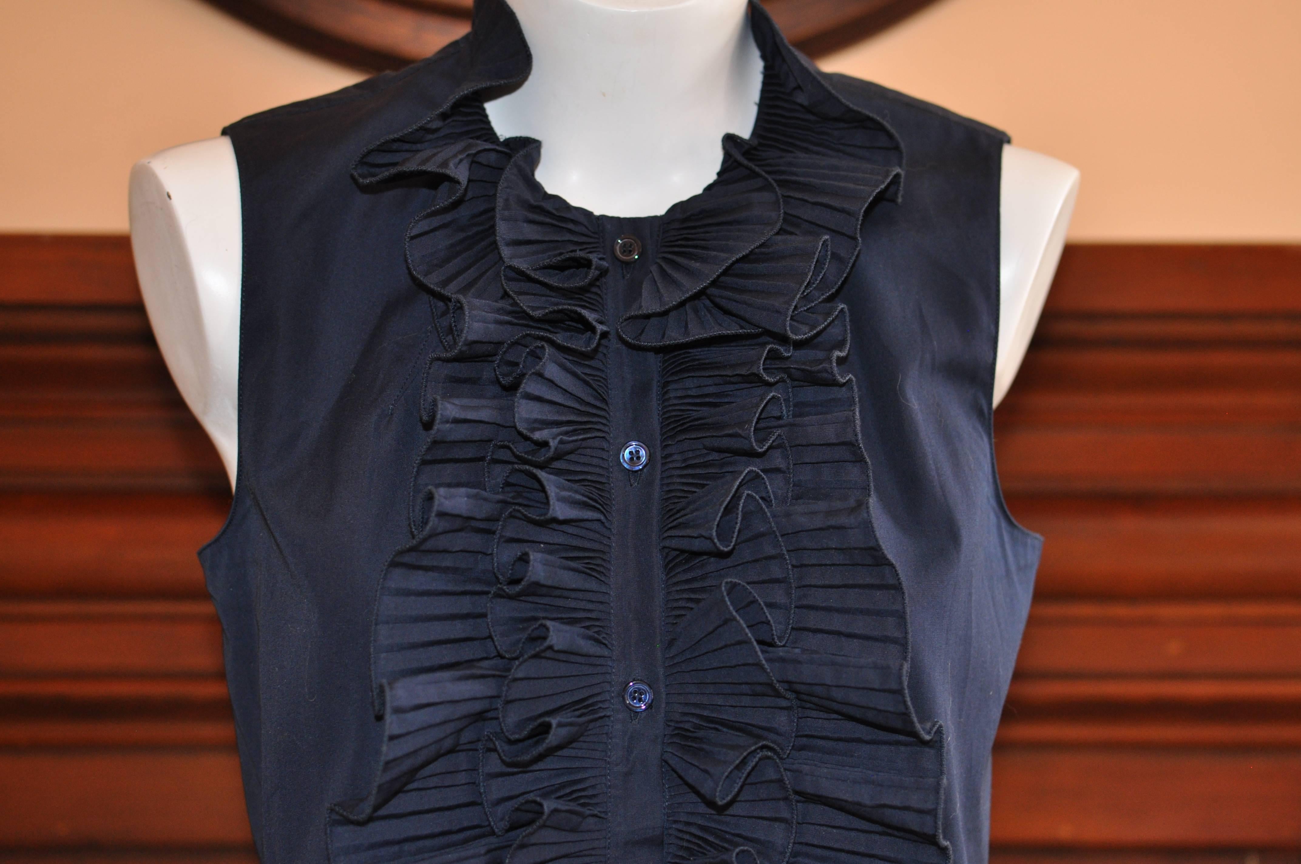 Lovely cotton blouse with permanent pleat double frill bib. Perfect to were with skirts, pants and shorts.