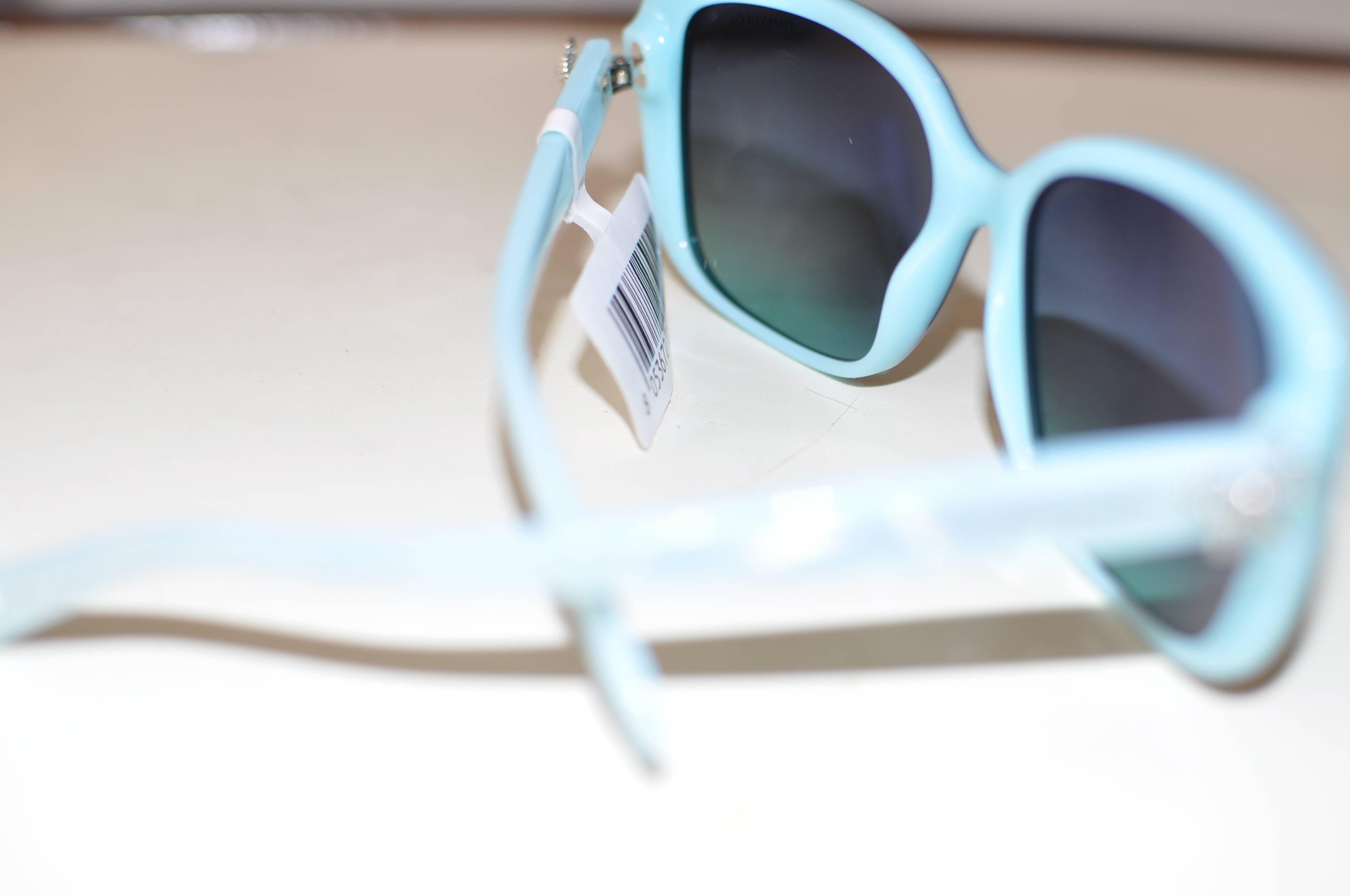 These sunglasses come in Havana and Tiffany Blue acetate with gradient brown lenses, which have 100% UV protection, and anti-glare coating. There are Swarovski crystal bows on the side and silver colored metal accents.

Sold out sunglasses at