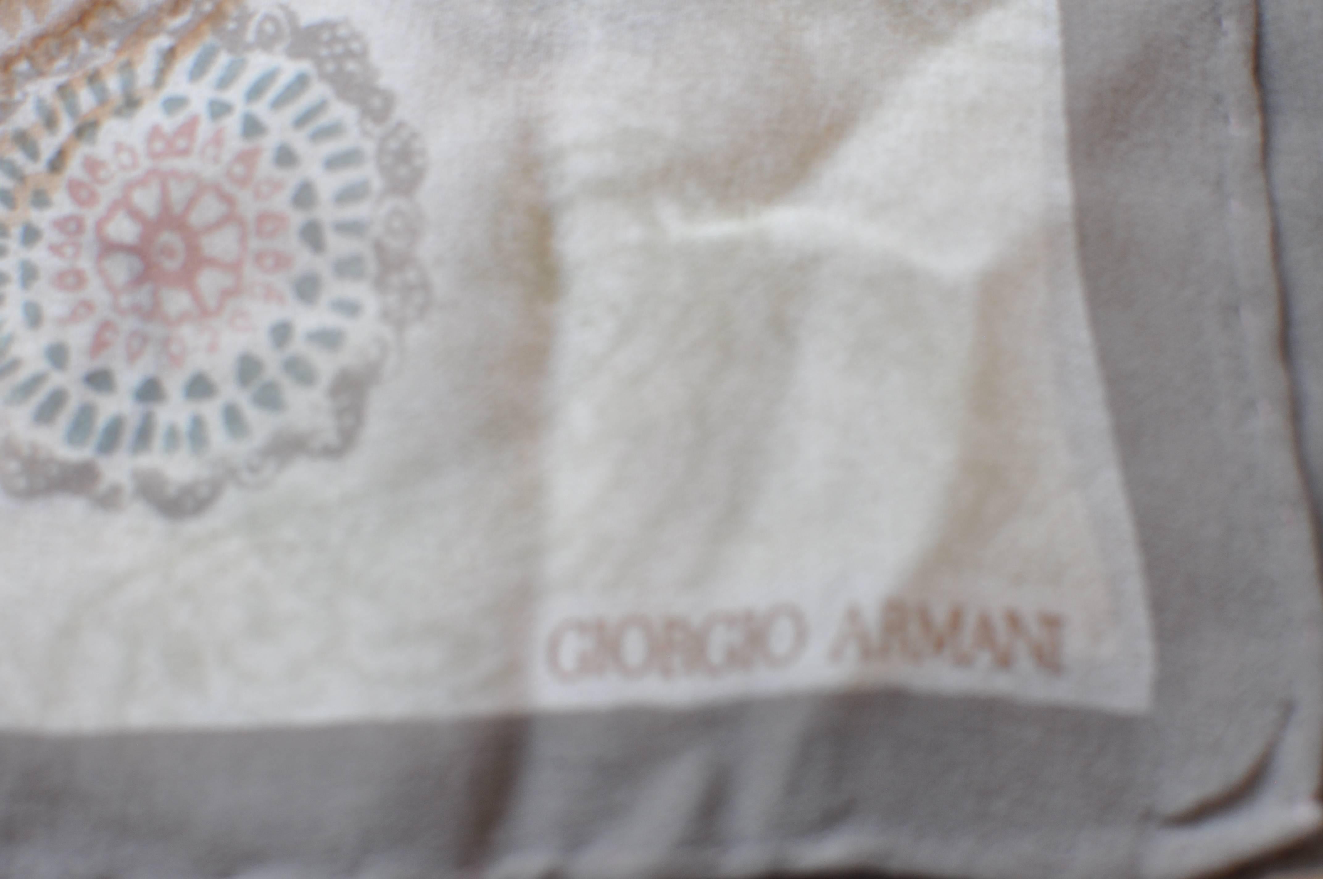 Very nice paisley print scarf by Giorgio Armani in silk chiffon. The grey/brown/beige colors are fairly muted, and will go well with almost every outfit.

The hand rolled edges are nice and plump.