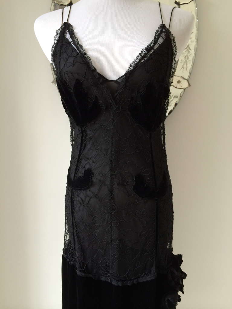 Beautiful and elegant lace dress with velvet details…. 
This feminine and timeless dress is composed of two parts. The slip dress is made of silk with a wide velvet border. The other dress is made of the finest lace with exquisitely sewn velvet