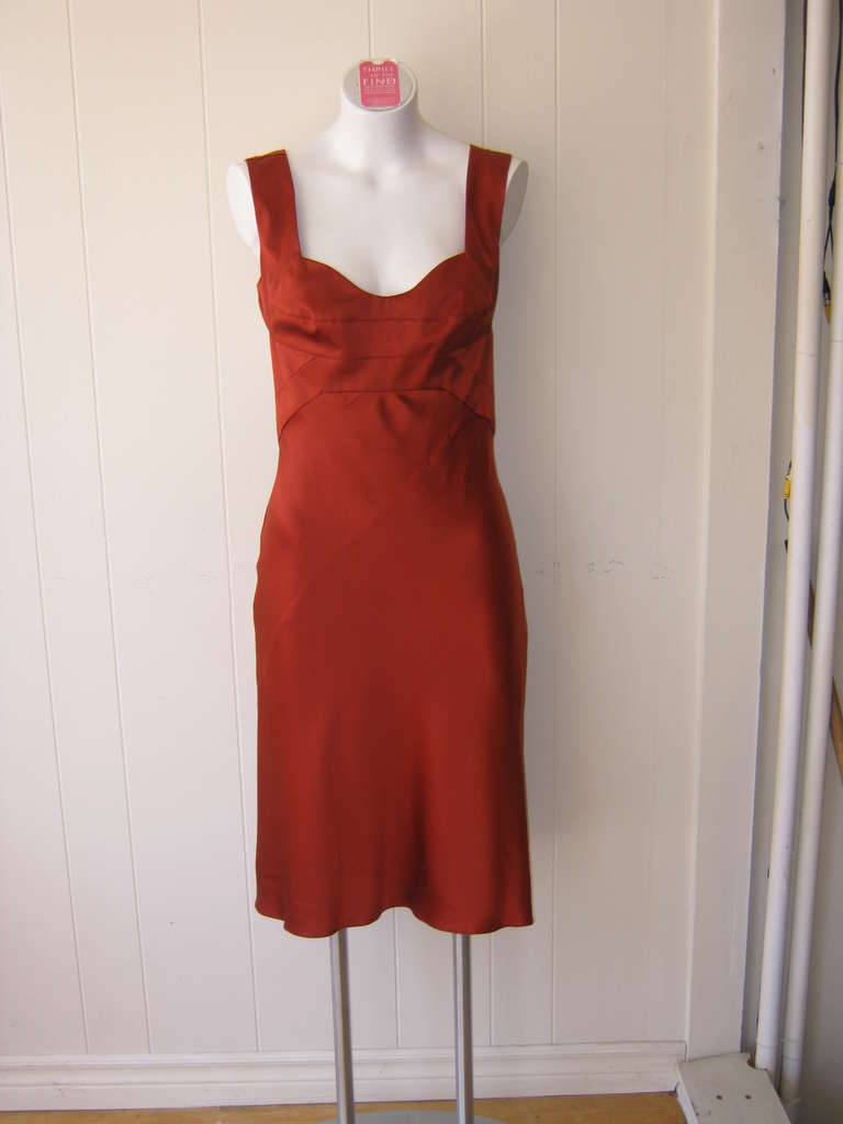 1940s glamour with a modern edge, this all silk dress has a top stitched bodice; criss-cross details; an exposed back and the silk envelops your curves.

As with many Narciso items of clothing this dress was manufactured in Italy.

Marked size