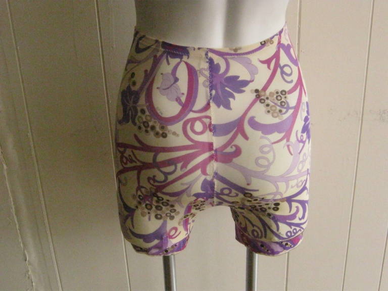 A rare classic swirling grape and leaf motif in vibrant shades of purple and brown. The waist is 22