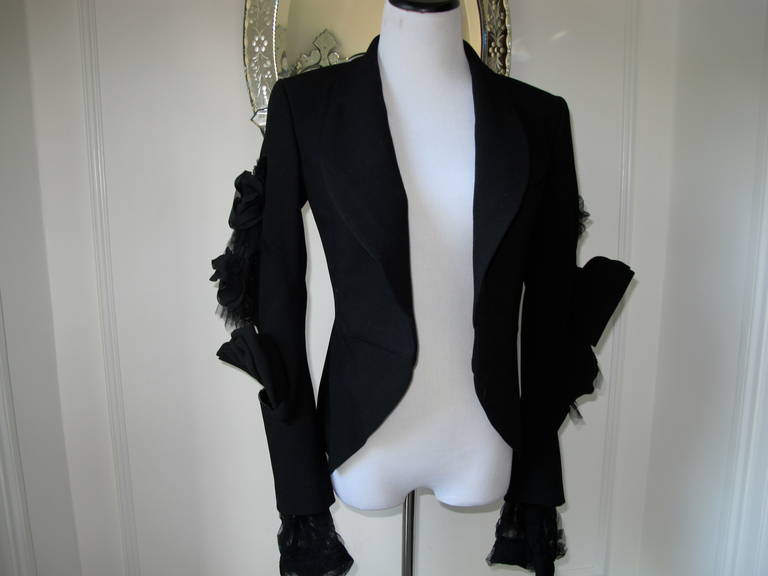 Incredible Vintage cropped blazer by Comme des Garcons.
Spectacular details on the sleeves makes this jacket a real conversation piece.
Oversized bows with tulle rushing and sheer cuffs ...
 Shoulders 20