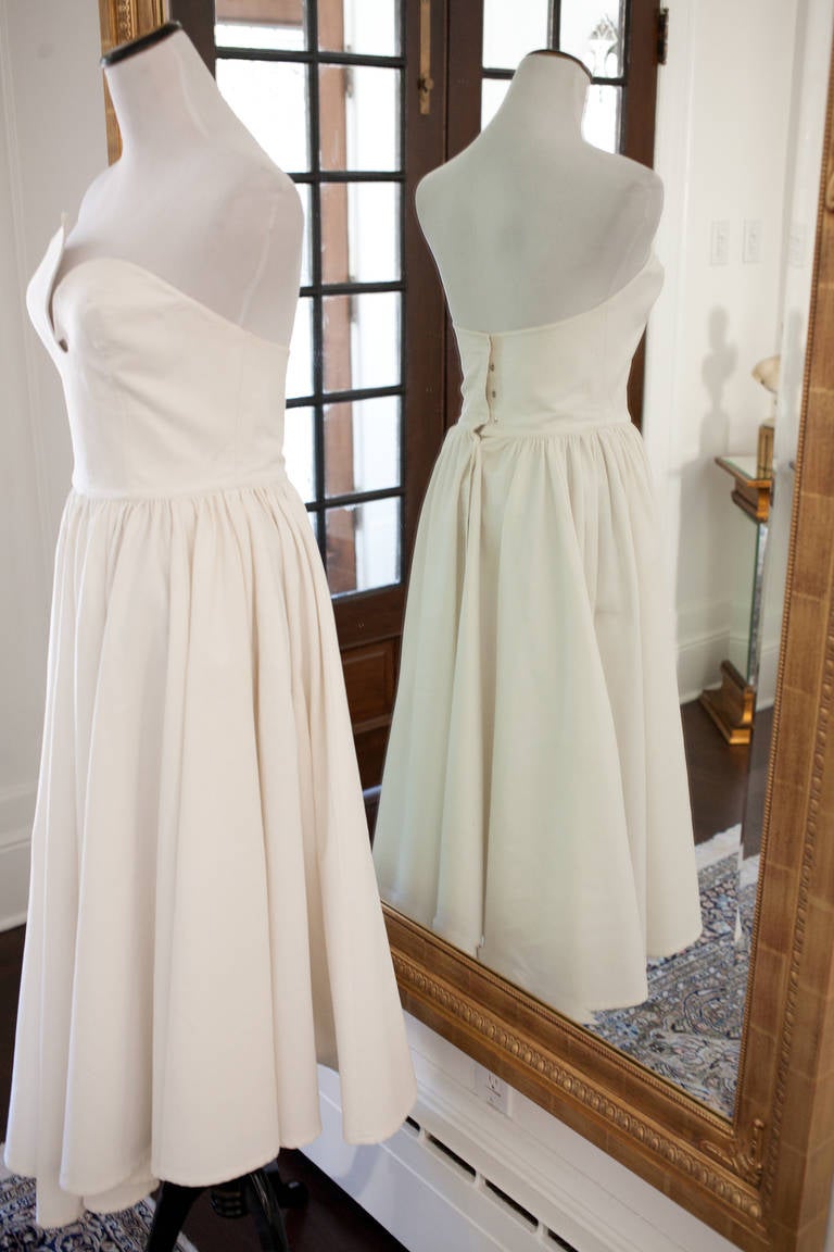 Thierry Mugler, the designer who redefined a generation with his modern, strong looks. Here he captures how to make a white bustier dress architectural, distinct and sensual at the same time. Truly a collecitble piece. All eyes on you when you wear