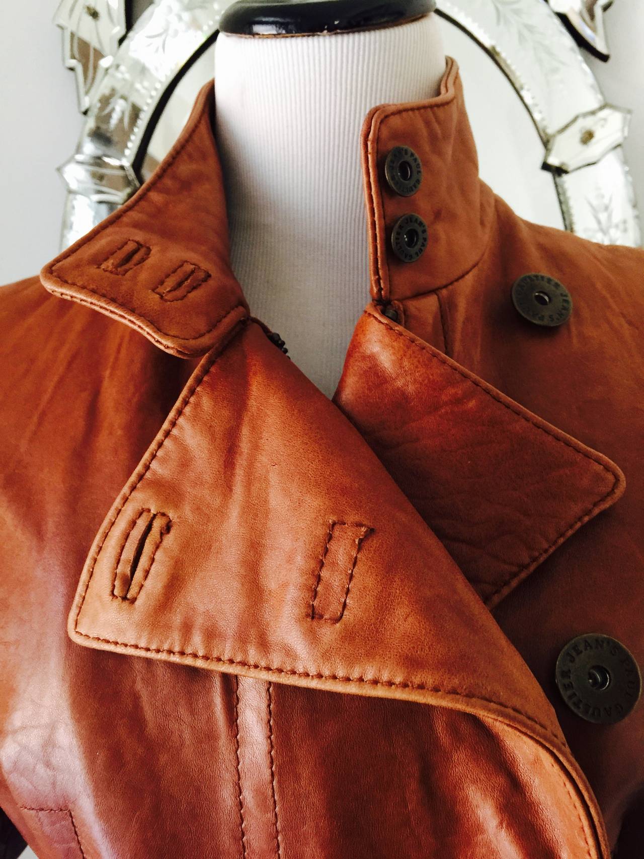 This is a perfect leather jacket for fall...in a rich cognac colour, lined in 
a leopard print this jacket has a lot of style...
many details and incredible fit...
hidden zipper...metal buttons...
the jacket is slightly padded for some extra