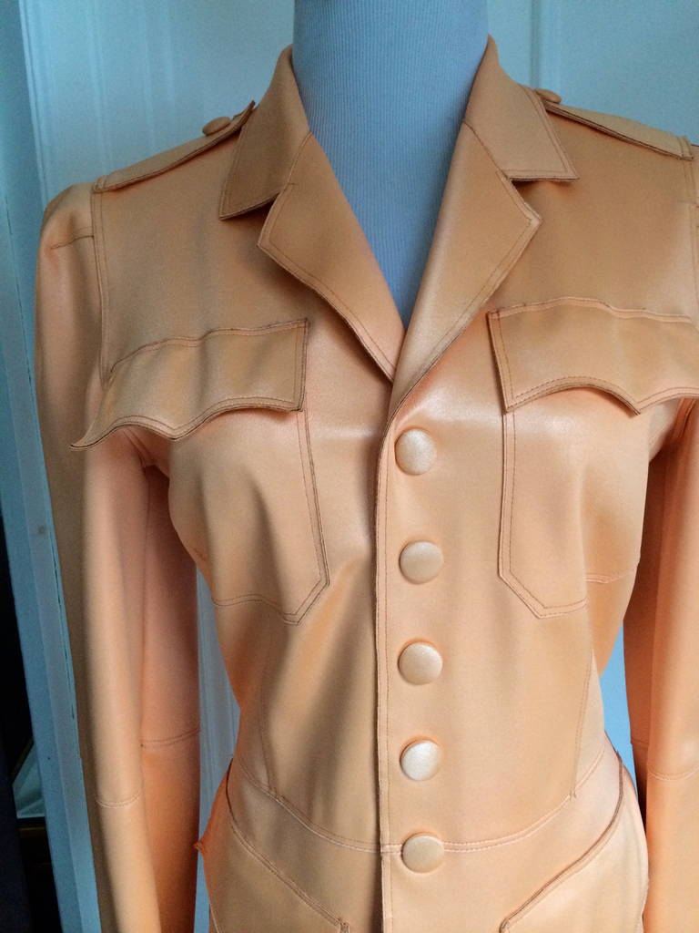 This unusual jean Paul Gaultier Jacket was cut in a polyurethane fabric but in a very classic and structured style.