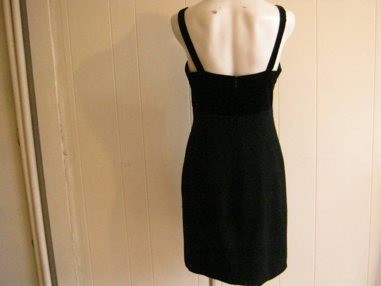 This is a very simple and extremely elegant Chanel cocktail dress from collection #17. The bodice is velvet with the rest of the dress a wool boucle.
The lining is the known silk with cc logo throughout.

Can be worn as a cocktail dress or as a