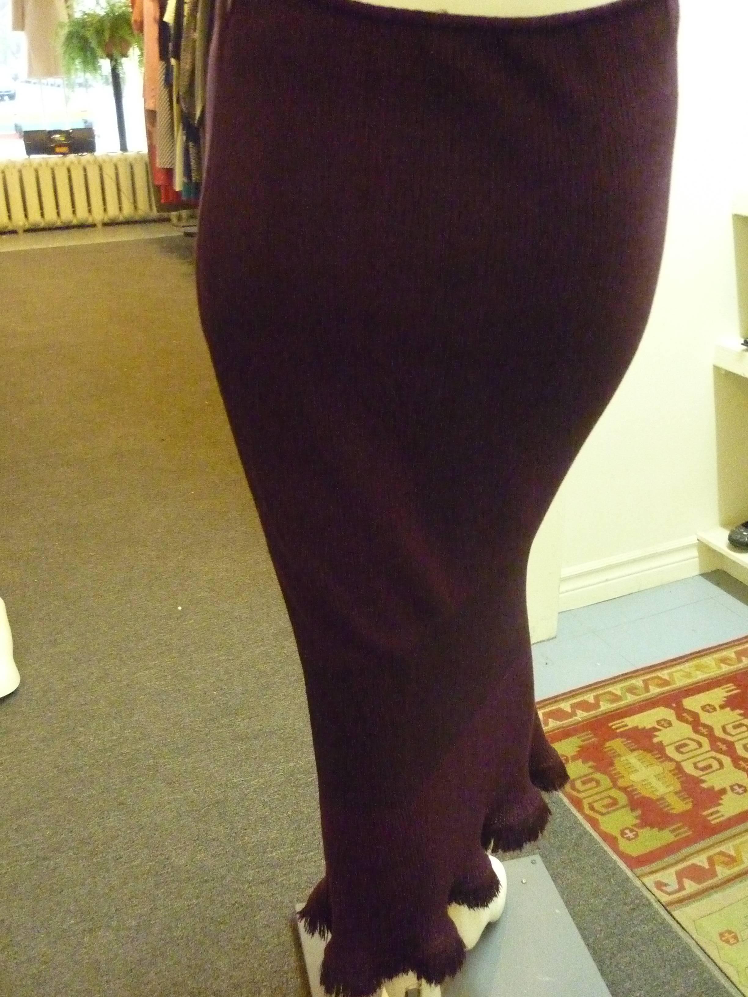 Lovely 50/50 wool and rayon skirt. The material is ribbed with three different patterns, the middle one having the feel of a bandeau and a slightly deeper aubergine color.

The bottom part of the skirt has a bit of an a-line as well as wispy wool