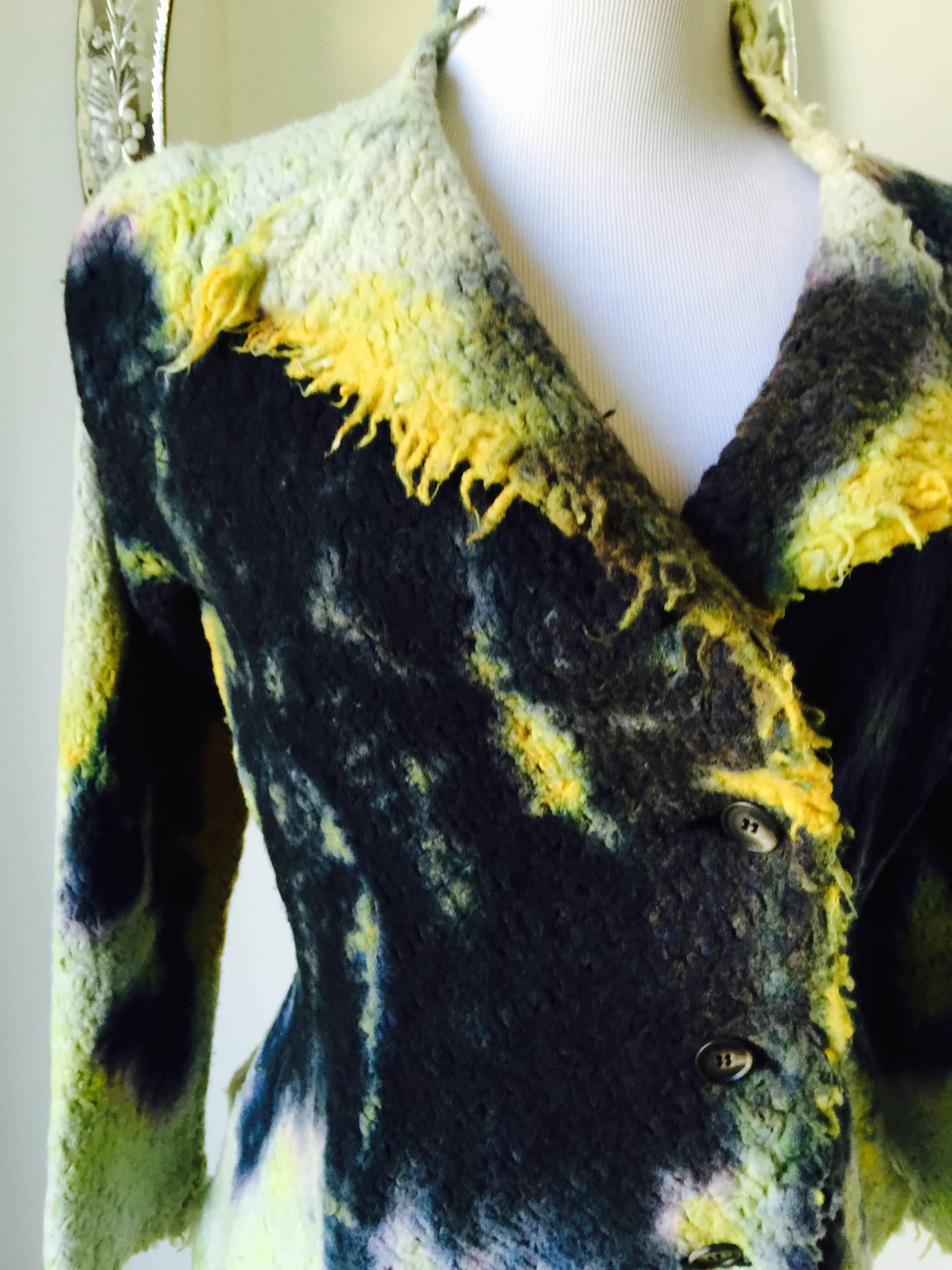 Yushiki Hishinuma is known for producing uniquely shaped clothing and integrating technology into traditional japanese tie dye designs.
An amazing piece by an amazing designer 
In boiled wool fit and flare style...unfinished hems...
make a
