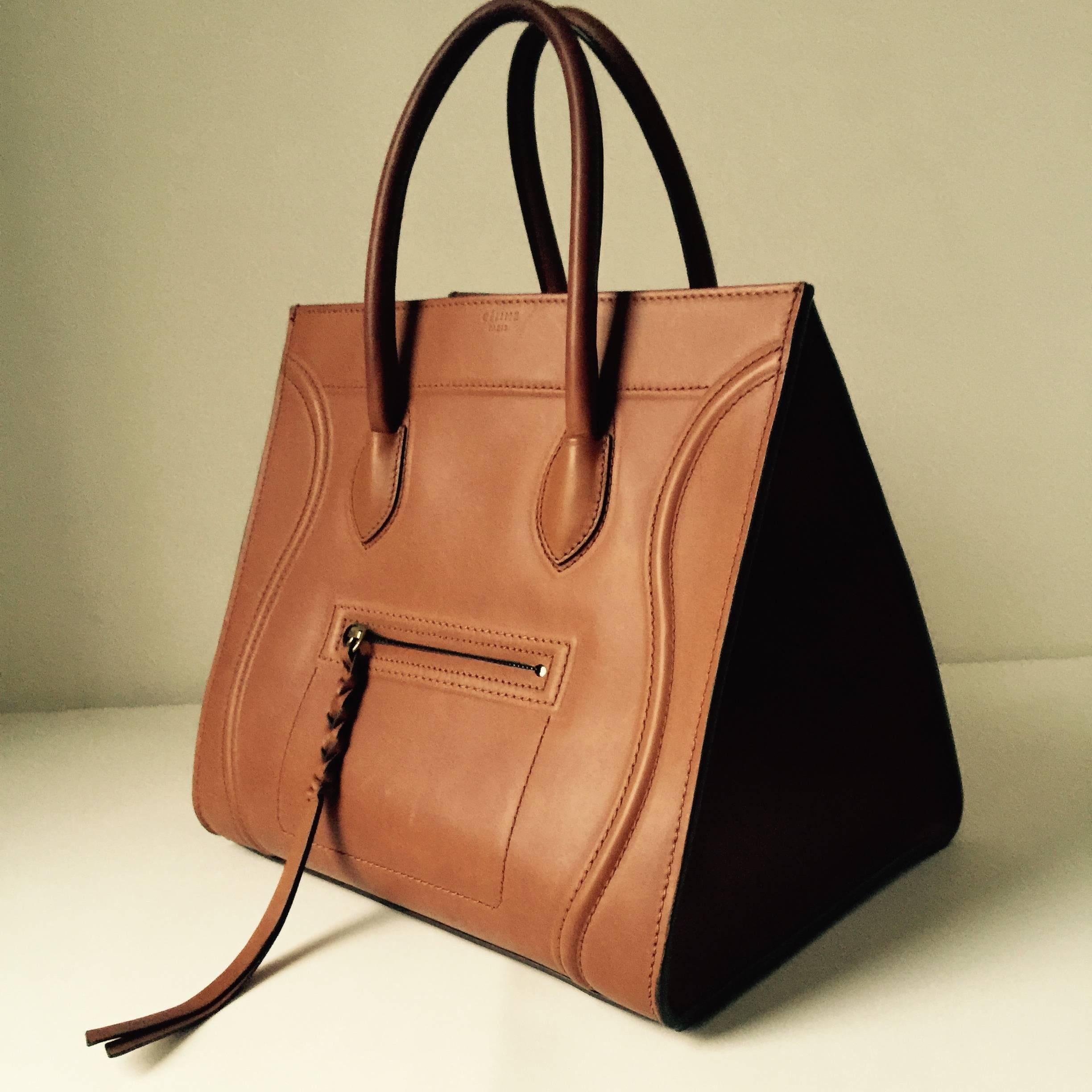 The Purse design by Phoebe Philo that brought Celine back on the fashion scene...
Classic construction that always looks sophisticated and chic...
featuring smooth calfskin leather... with rolled top handles.....suede lined interior...with open