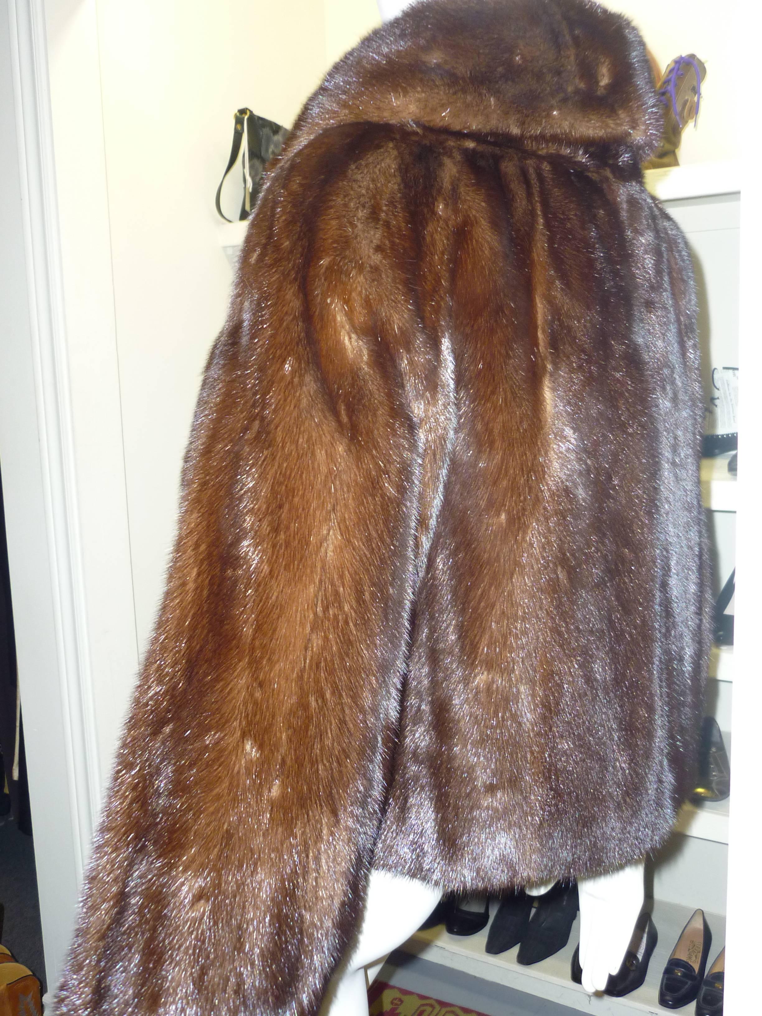 For a fur jacket that is over 60 years old, it is in great shape, with only some wear on the logo lining, minor wear on the fur itself, and no tears.

The jacket has a shawl collar; 3/4 sleeves with wide cuffs and closure is by way of two eye and