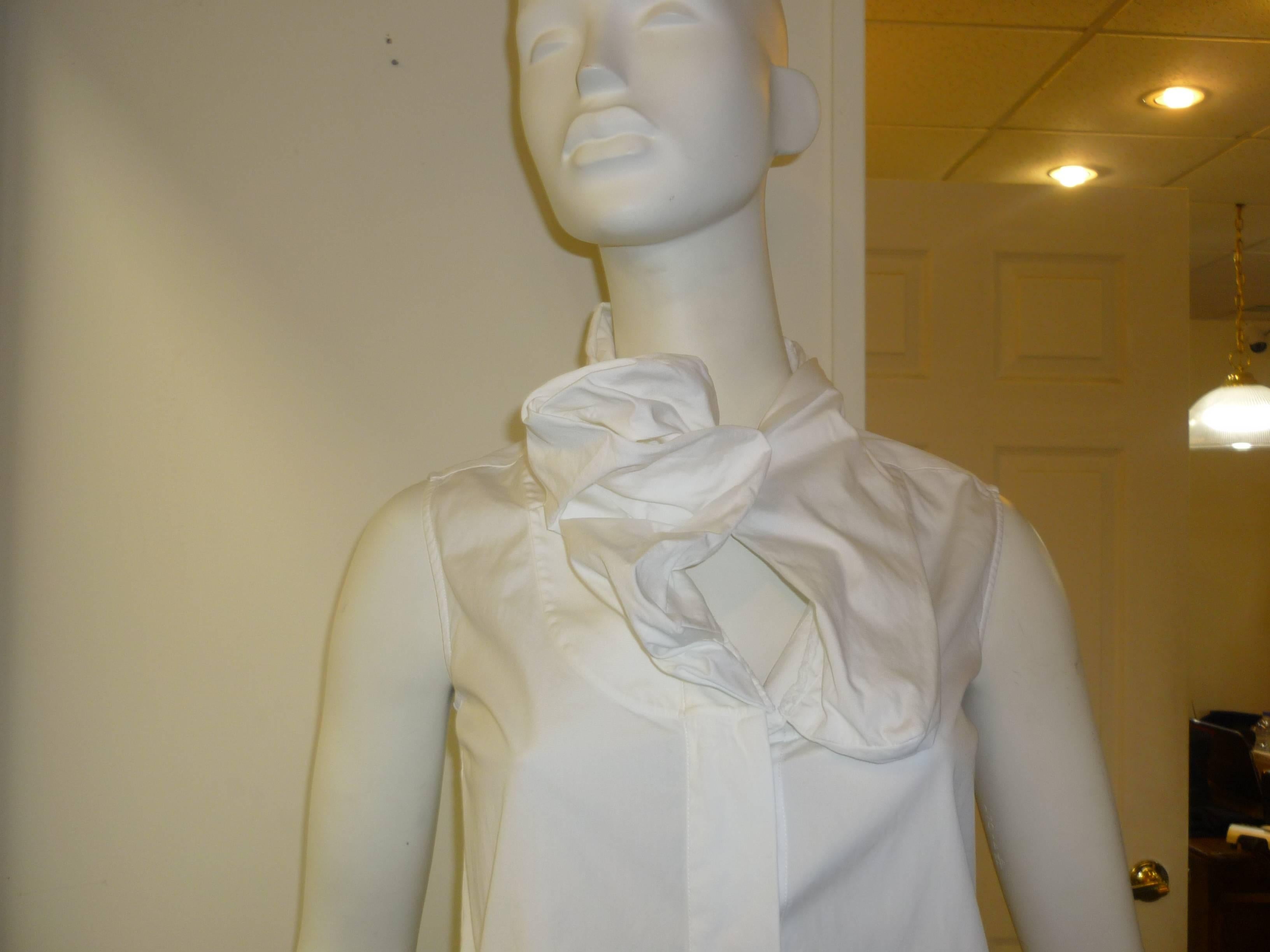 The detail at the collar is reminiscent of Watanabe's style. The ruffle is multi-layered and can be left open or there is a one button closure as per the pictures.

Down the front there is are concealed button, and the back has a tuxedo pleat.