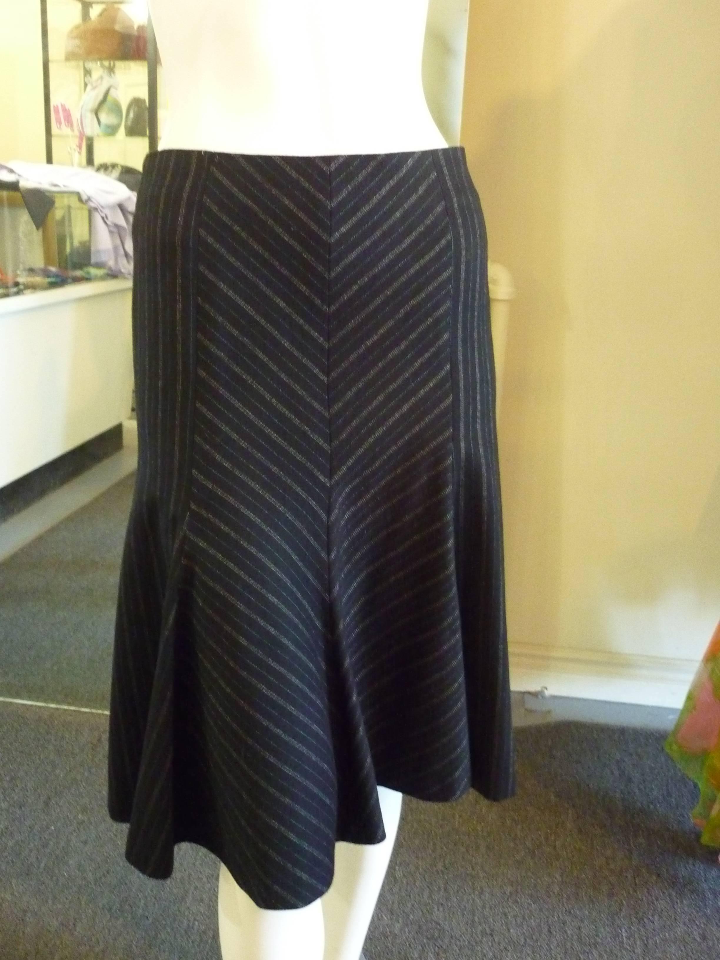 This a-line skirt with godet bottom, has a chevron and stripe pattern. What sets it apart from a regular skirt is the addition of the cummerbund. Your choice, on or off!

The skirt is lined with the Missoni chevron pattern.
