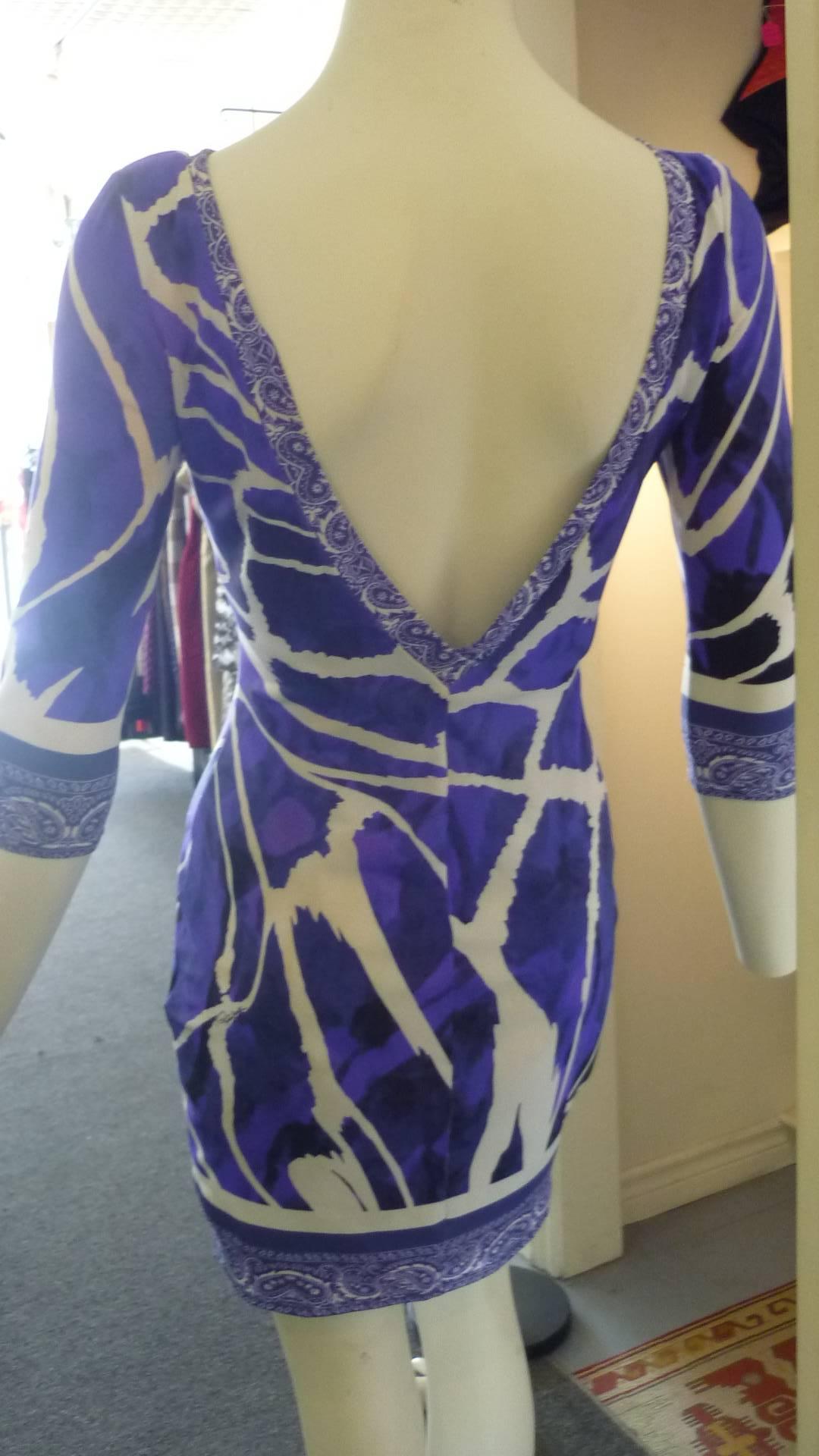 Purples, black and white mixed patterned dress with the Roberto Cavalli signature. Easy to wear and pack, and very becoming.

The material (polyamide) is stretchy and all measurements were taken flat.