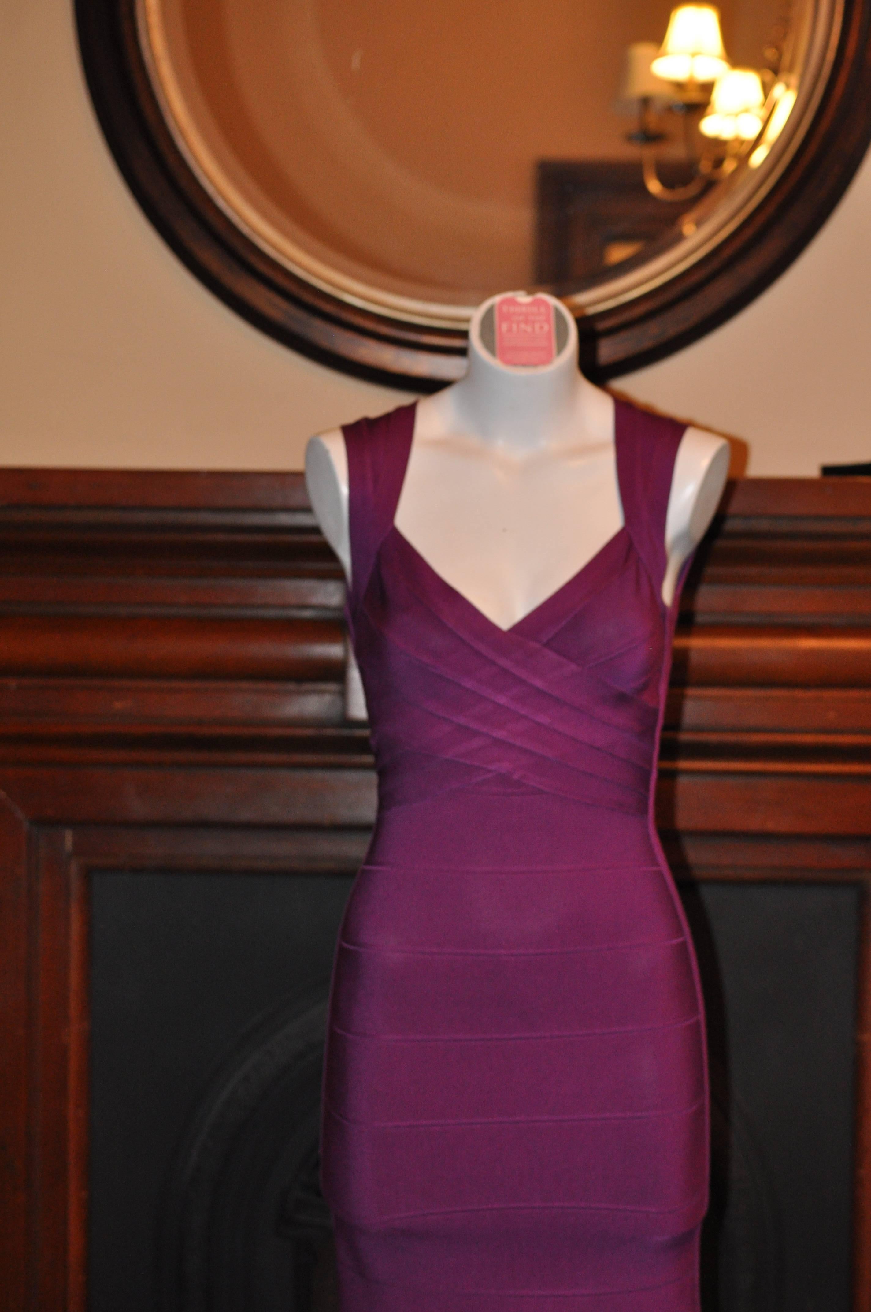 Beautiful and iconic Herve Leger bandeau dress with a scoop back and a decorative strap at the back.