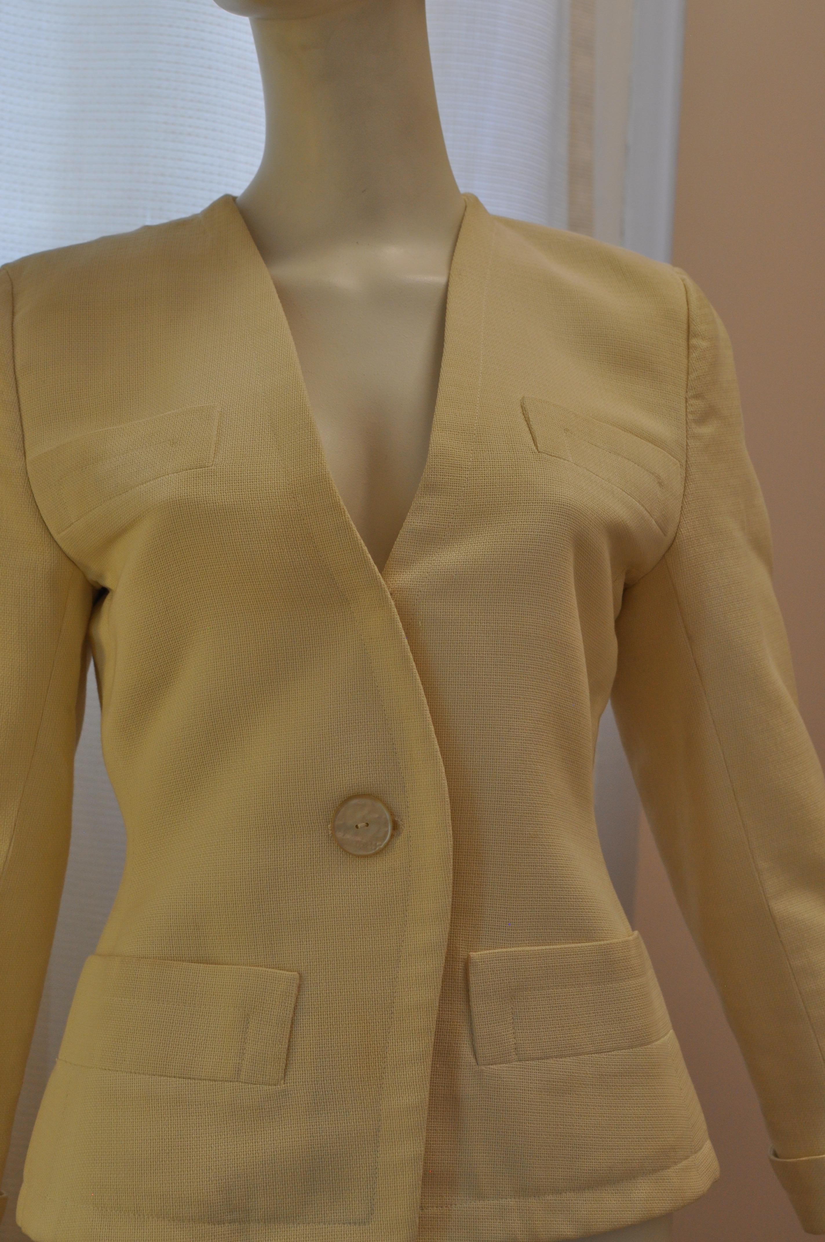The care tag is missing but I believe a heavy cotton close weave material was used.  The off white v-neck jacket has four usable slash pockets: two at the  bust and two at the hips. The cuffs are turn up and there is a one button closure.

I will be