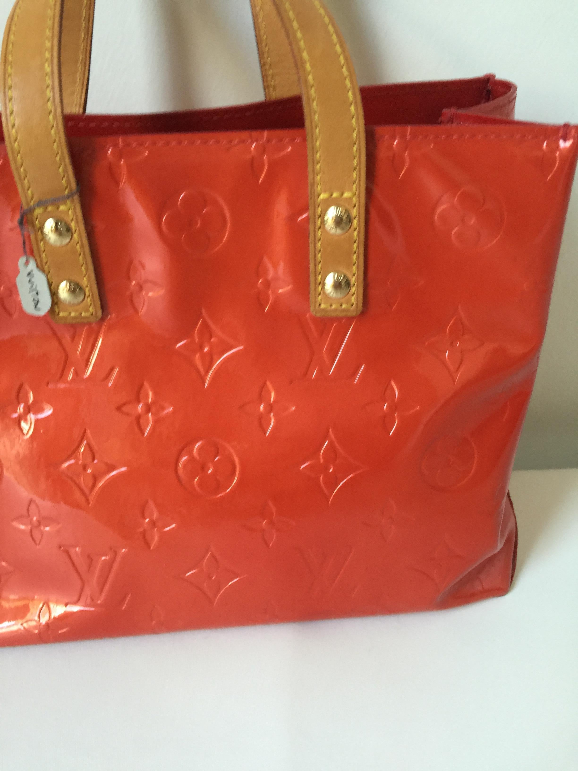  Monogram red patent Louis Vuitton mini tote with tan top handles.
Can be used as a special occasion bag
Dust bag