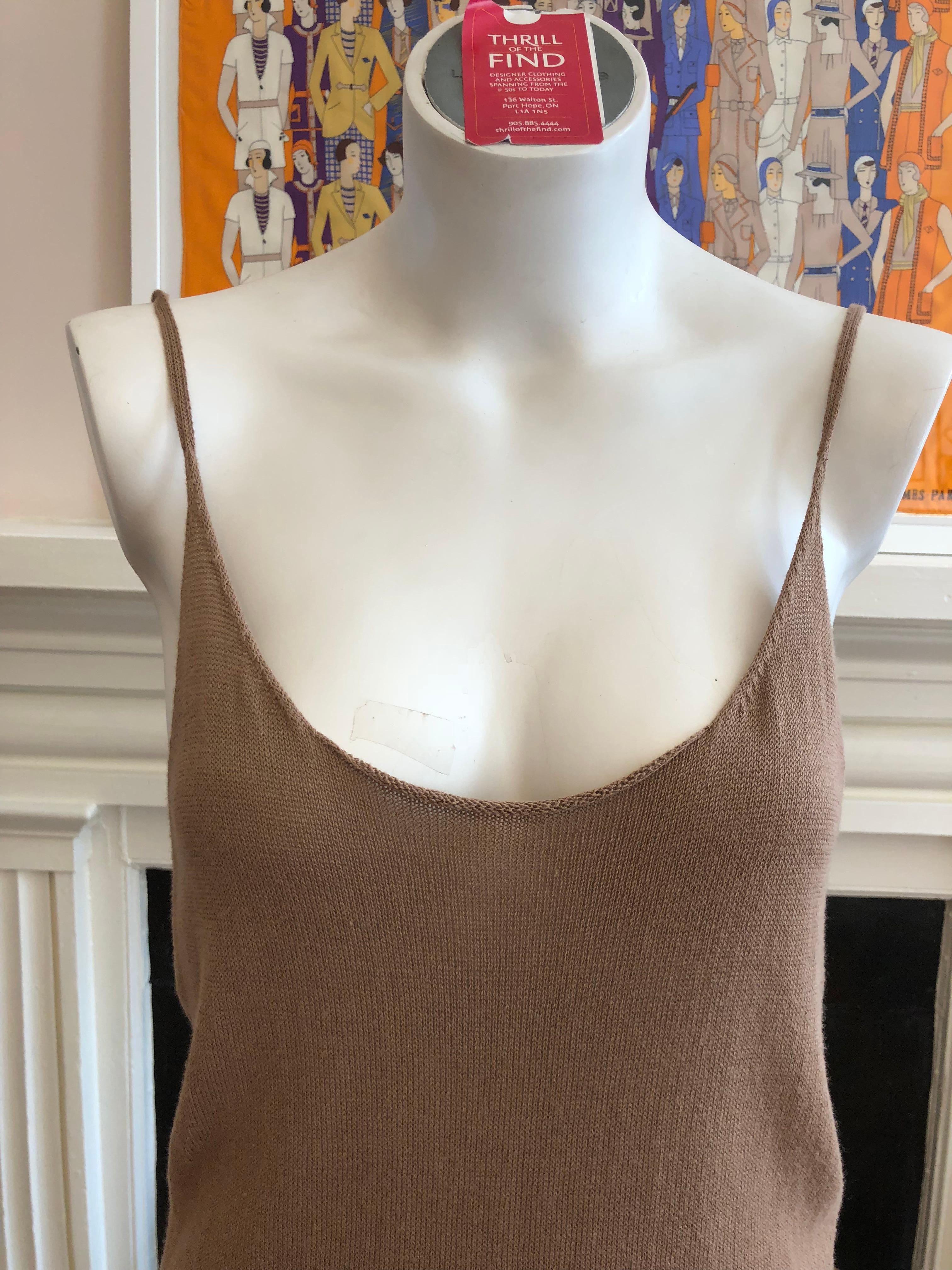 Made in Belgium this is a very nice quality cotton top with spaghetti straps and ribbed hem. Please note that there is stretch to the material.