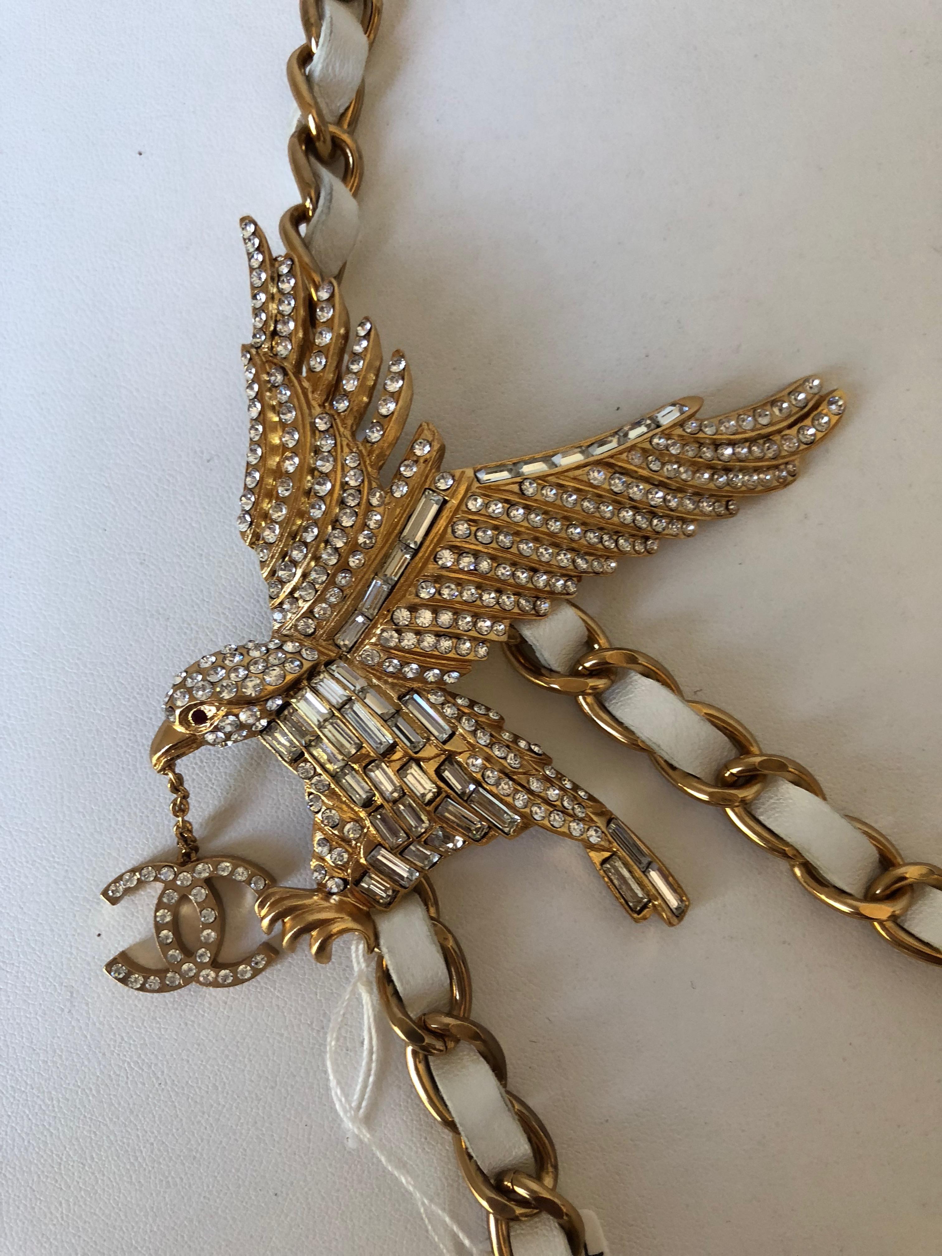 Focal point of the Chanel 2001 Spring Collection.
Rare Chanel belt with white interwoven leather featuring a large jewelled eagle.
May be worn as a belt or a necklace.
