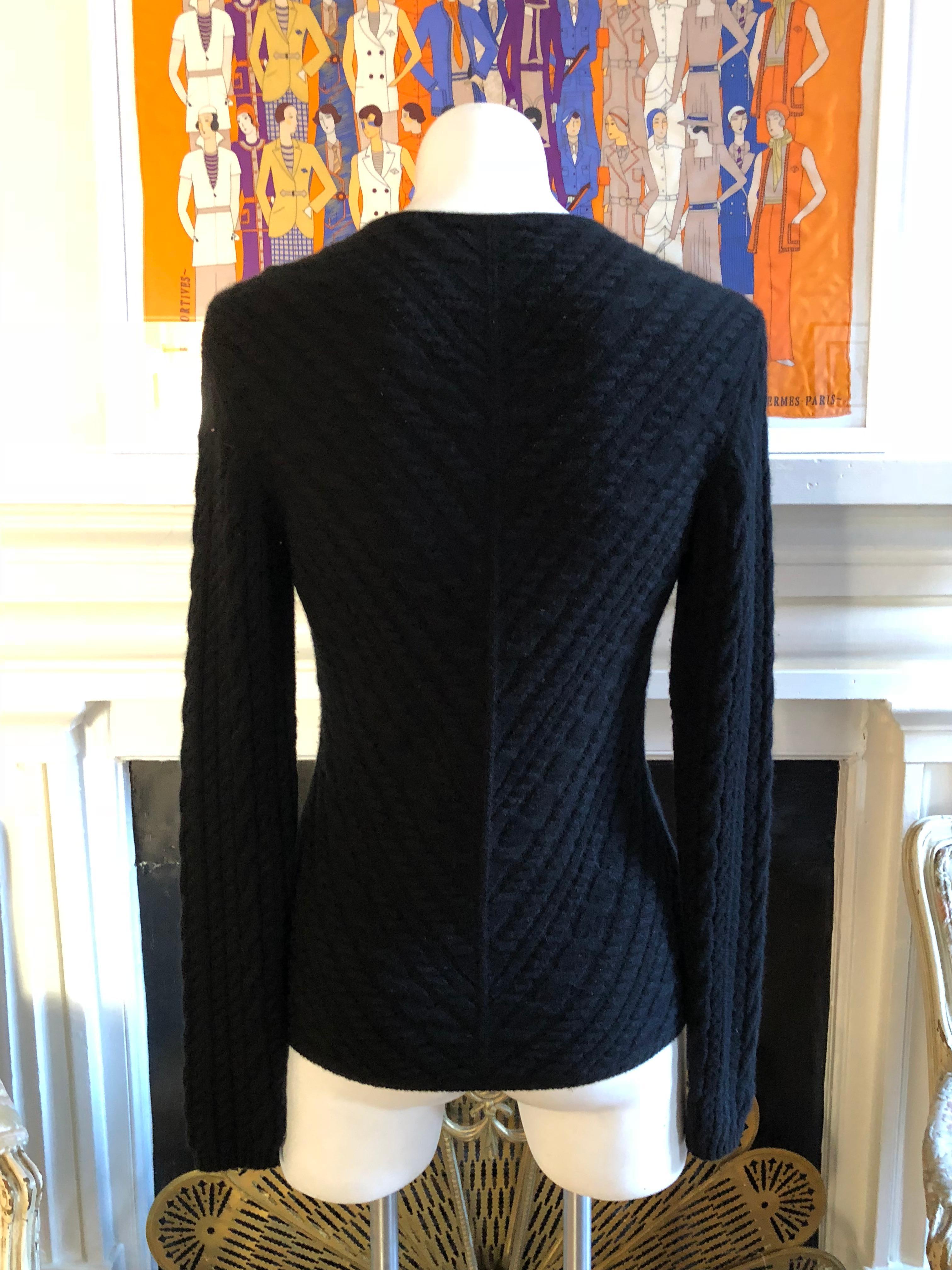 One of the best cashmere brands,  this Loro Piana sweater is both stylish and warm. The sweater is V-necked and the ribbing pattern is v-shaped on the body and vertical on the sleeves. I call it ribbing, but it is in fact more like an amalgamation