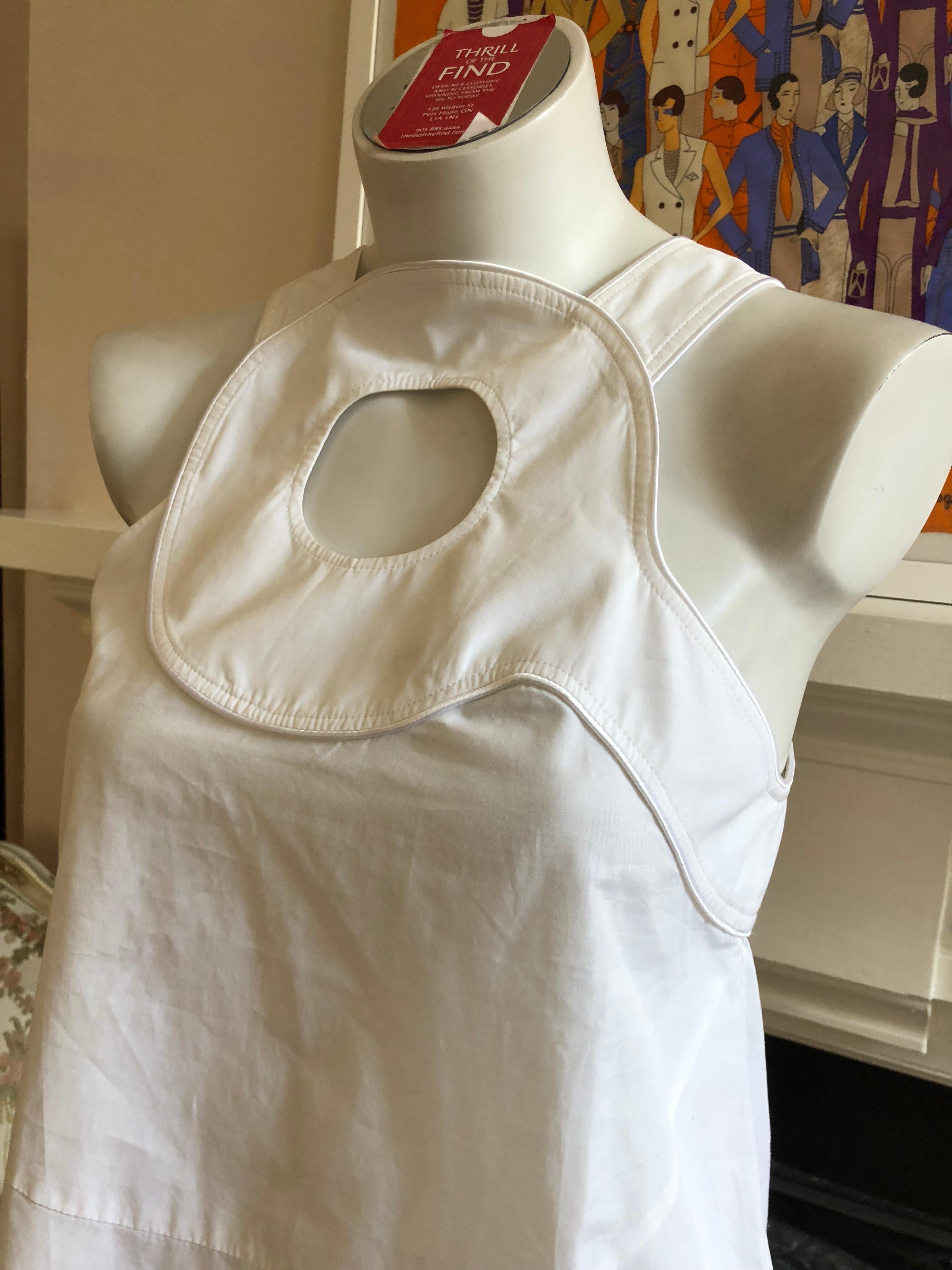 Made in Italy this is a fine cotton sleeveless blouse with a circular keyhole design at the front.