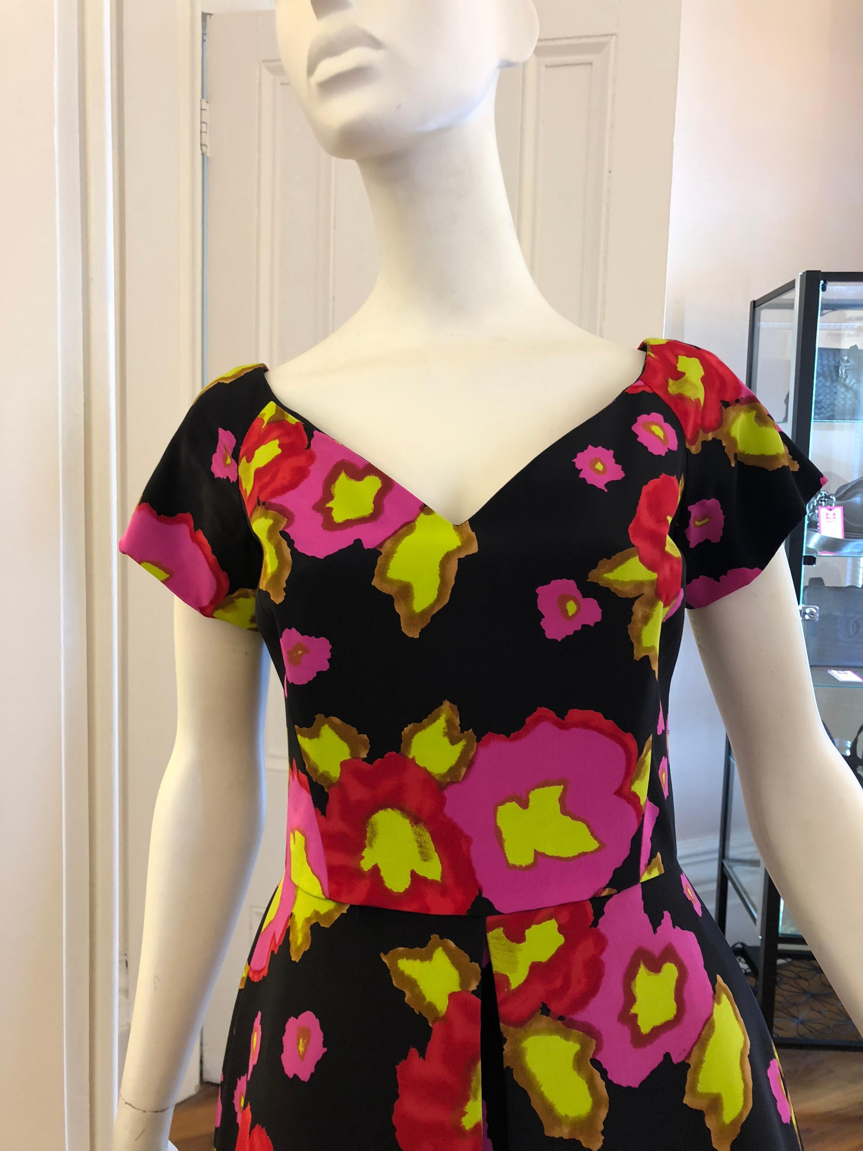 This vintage silk Scaasi dress is in excellent condition a nd is very well made with double facing; a front centre inverted pleat, and boning on the top half of the dress. Because of the quality of the lining, the skirt retains its wonderful A-line