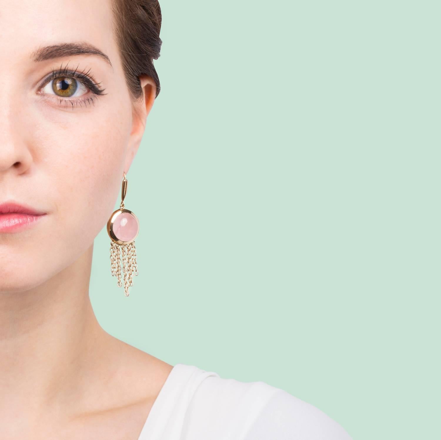 18kt Gold Vermeil (2.5 microns) on 925 Silver (Rhodium coated to enhance the colour of the metal)

These light and delicate chain earrings are perfect for day wear or special occasions.

They feature natural pink quartz cabochons with hanging