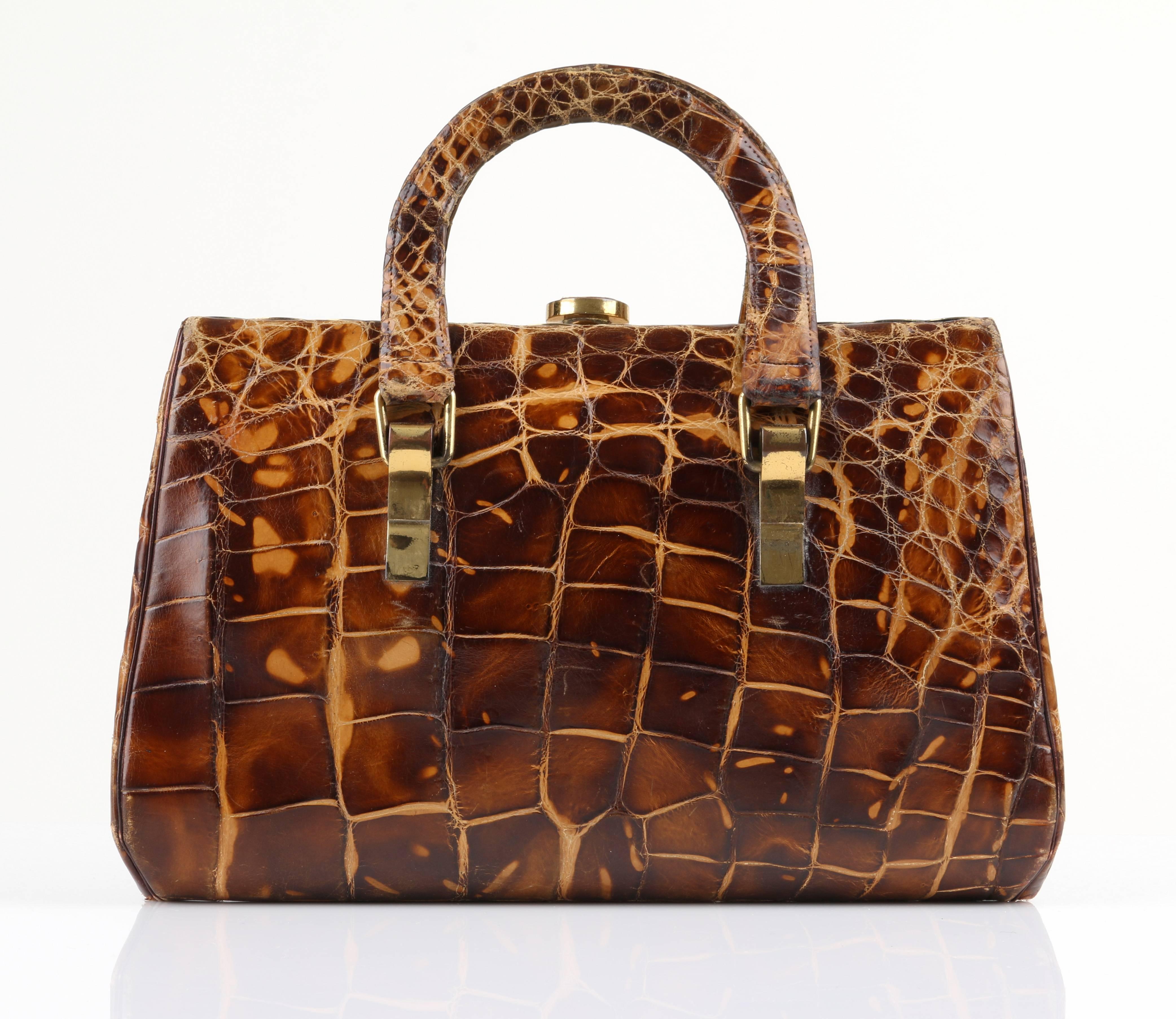 Incredibly Rare Vintage 1930s Hermès brown genuine alligator handbag. Two handles. Gold-tone metal hinged frame and hardware. Metal and alligator clasp at top. Interior has two main compartments divided at the center by an attached kiss clasp coin