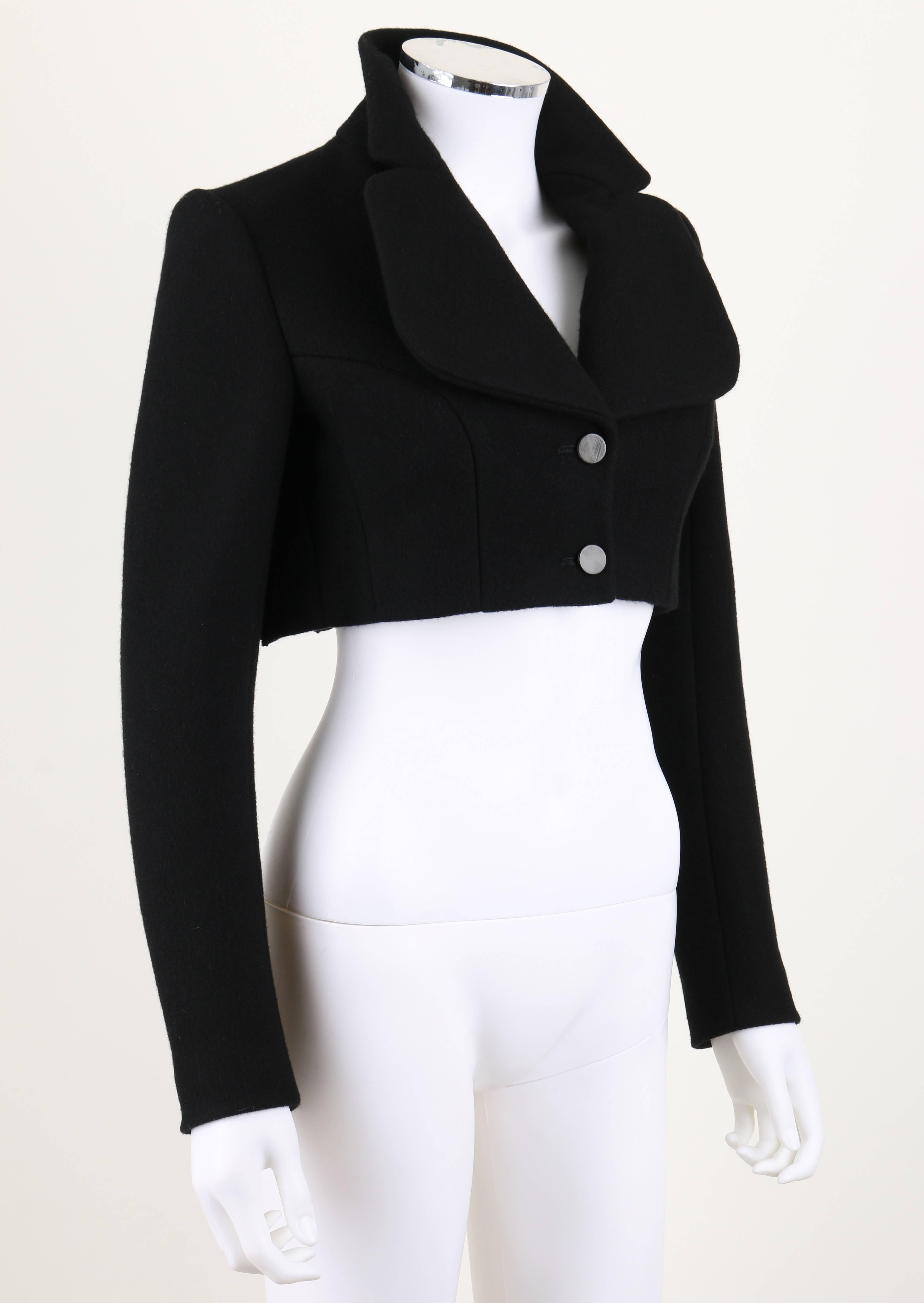 Alaia Paris black wool/cashmere cropped jacket. Full pleated back. Large lapel. Two button closure at front. Interior lacing corset-like lining at back. Fully lined.
Marked Fabric Content: 