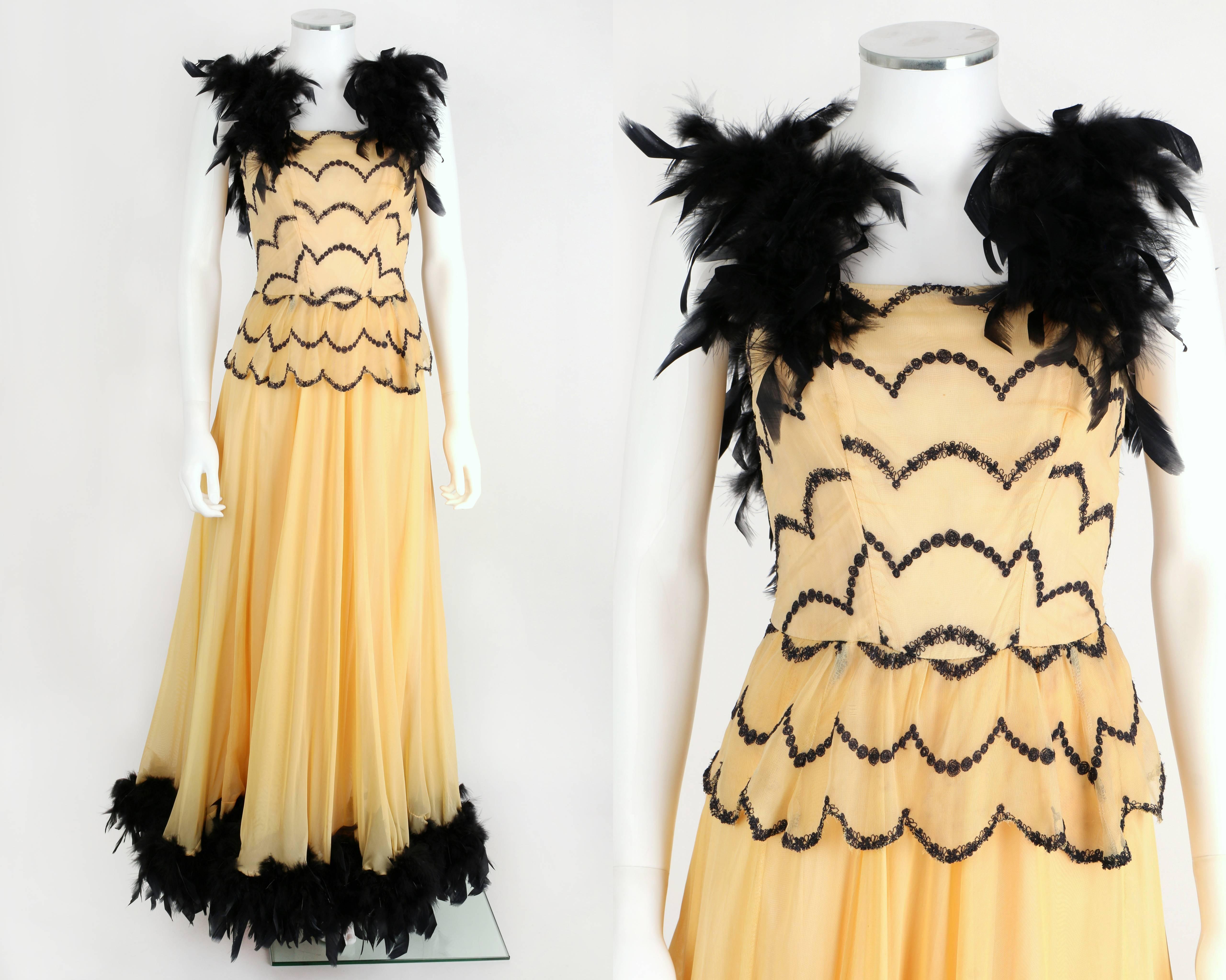 One-of-a-Kind circa 1930's / 1940's deep ivory fine net / mesh evening gown.  Black feather trim at straps and hem. Black embroidered detail at bodice.  Dress zips at center back, and is fully lined. Full skirt. There is no fabric content label,