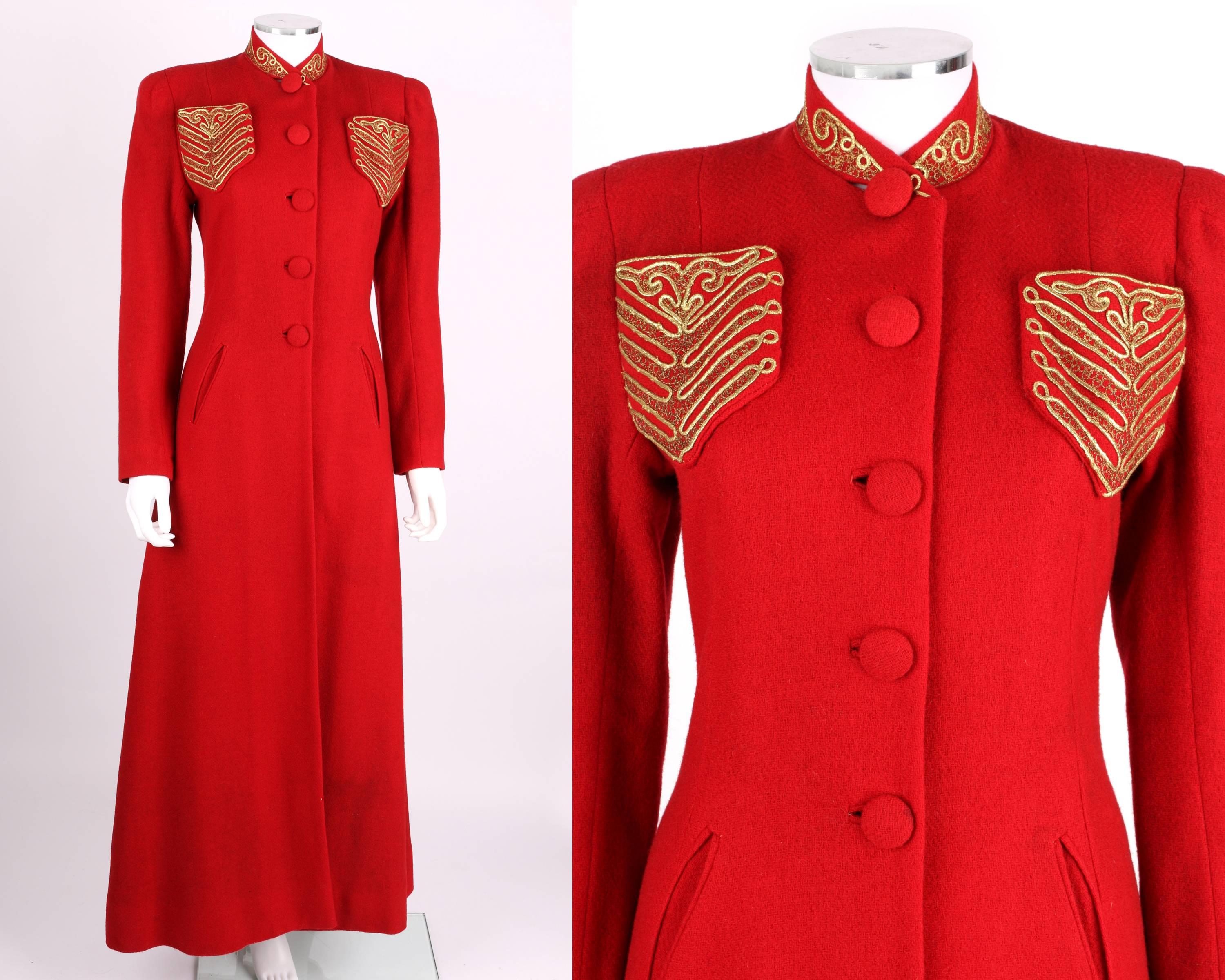 Striking circa 1939 red wool princess cut evening coat purchased at Chas. A. Stevens & Co. Attributes of Elsa Schiaparelli's work. High collar and two small chest pockets are embellished with gold metallic cording and embroidery. Two slant pockets