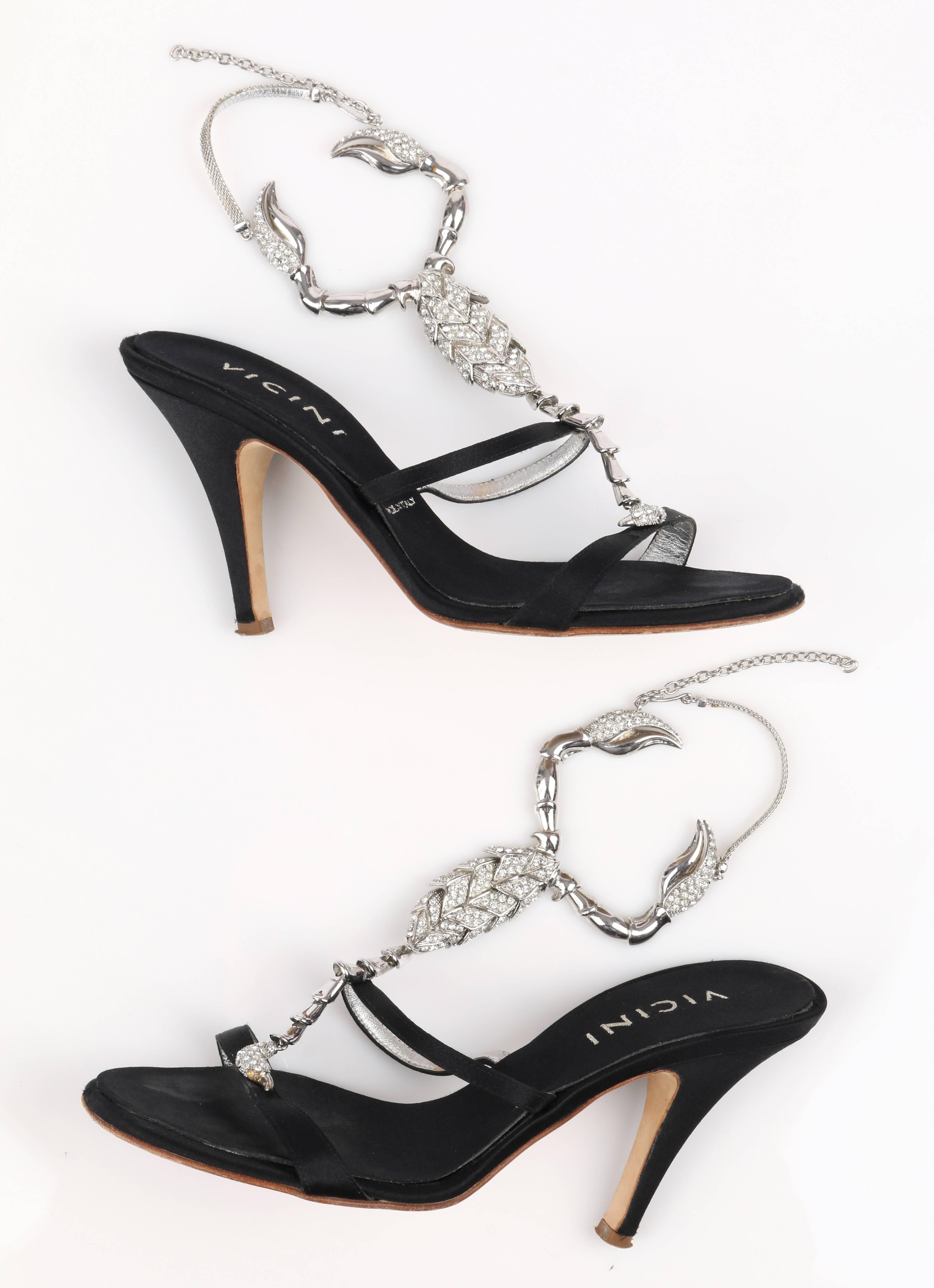 Vicini by Giuseppe Zanotti Limited Edition 2015 black satin scorpion embellished high heels. Upper is detailed with a large silver & diamond-rhinestone embellished scorpion design. Open toe. Back ankle strap is silver chain with adjustable hook.