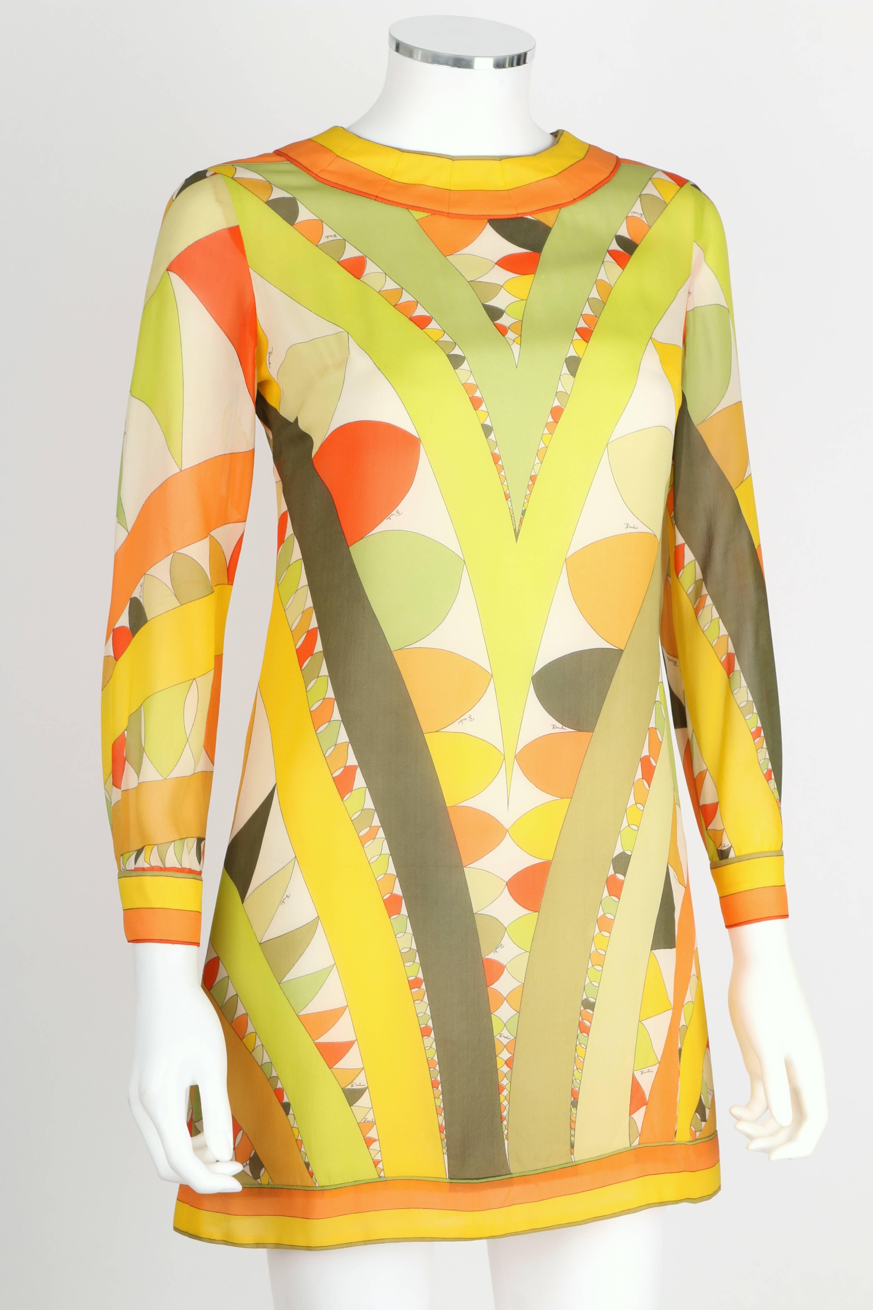 Vintage c.1960's Emilio Pucci signature print silk chiffon/georgette shift dress in shades of green, orange, yellow and white. Jewel neckline. Long sleeves button at fitted cuffs. Back center zipper. Lined. Marked Fabric Content: 
