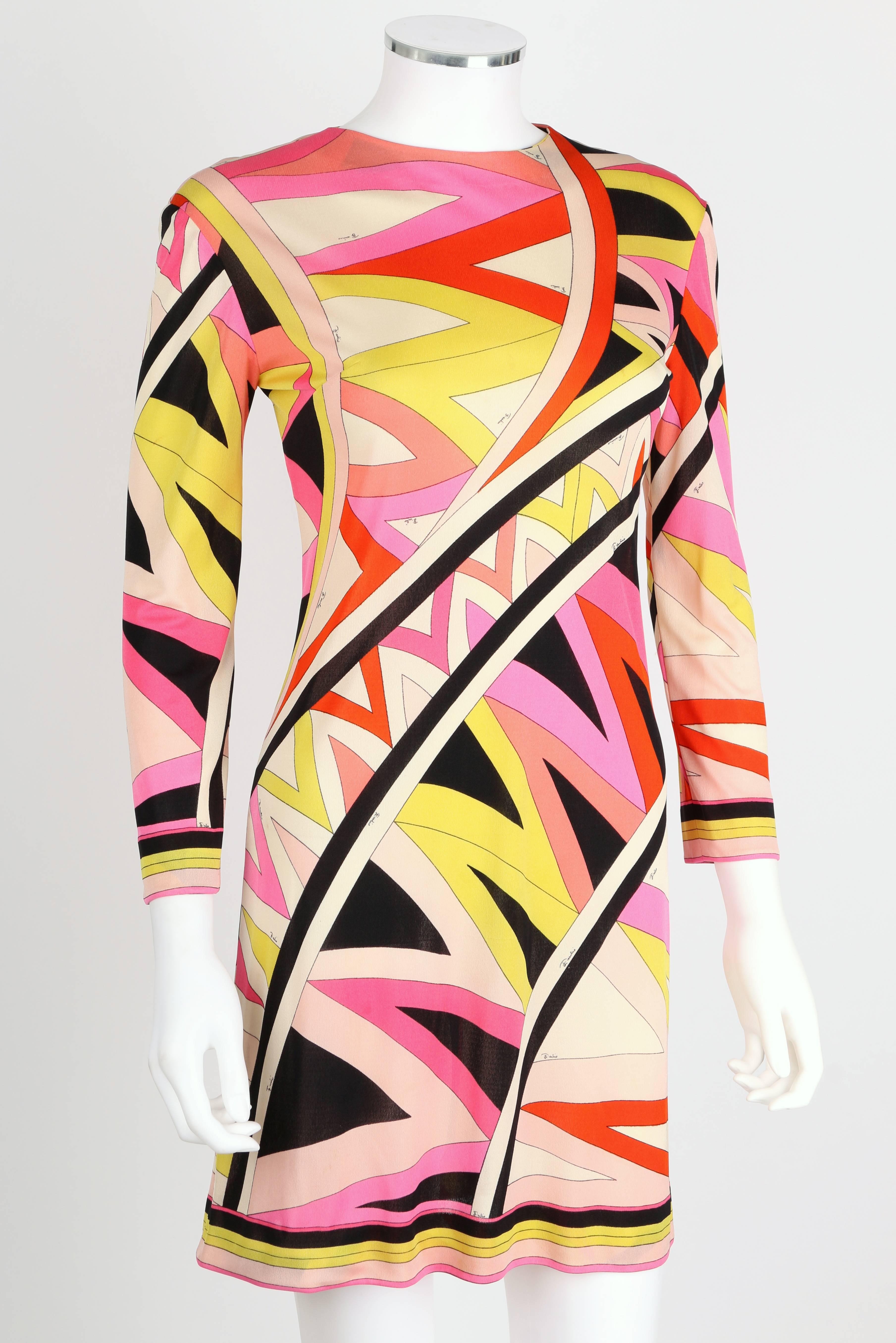 Vintage 1960s Emilio Pucci silk jersey shift dress. All over multi-color signature print. High rounded neckline. Wrist length sleeves. Zips at center back. Marked Fabric Content:  