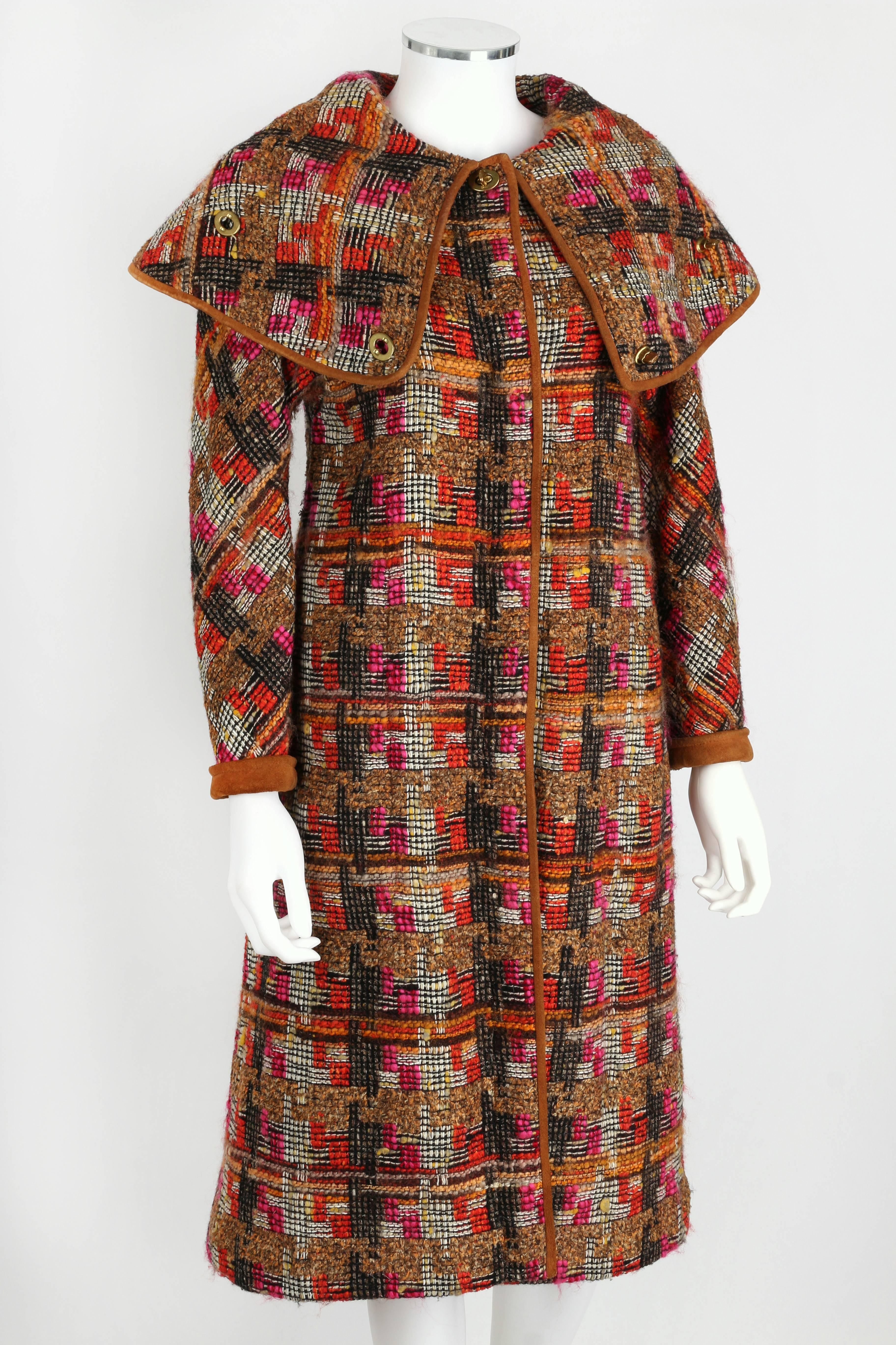 Vintage 1960s Bonnie Cashin for Sills multi-color boucle tweed cape coat. Large storm flap collar. Brown genuine suede leather trim. Two pockets. Classic COACH turn-lock and hidden snap closures. Also contains a tag for Cele Peterson, Tuscon.