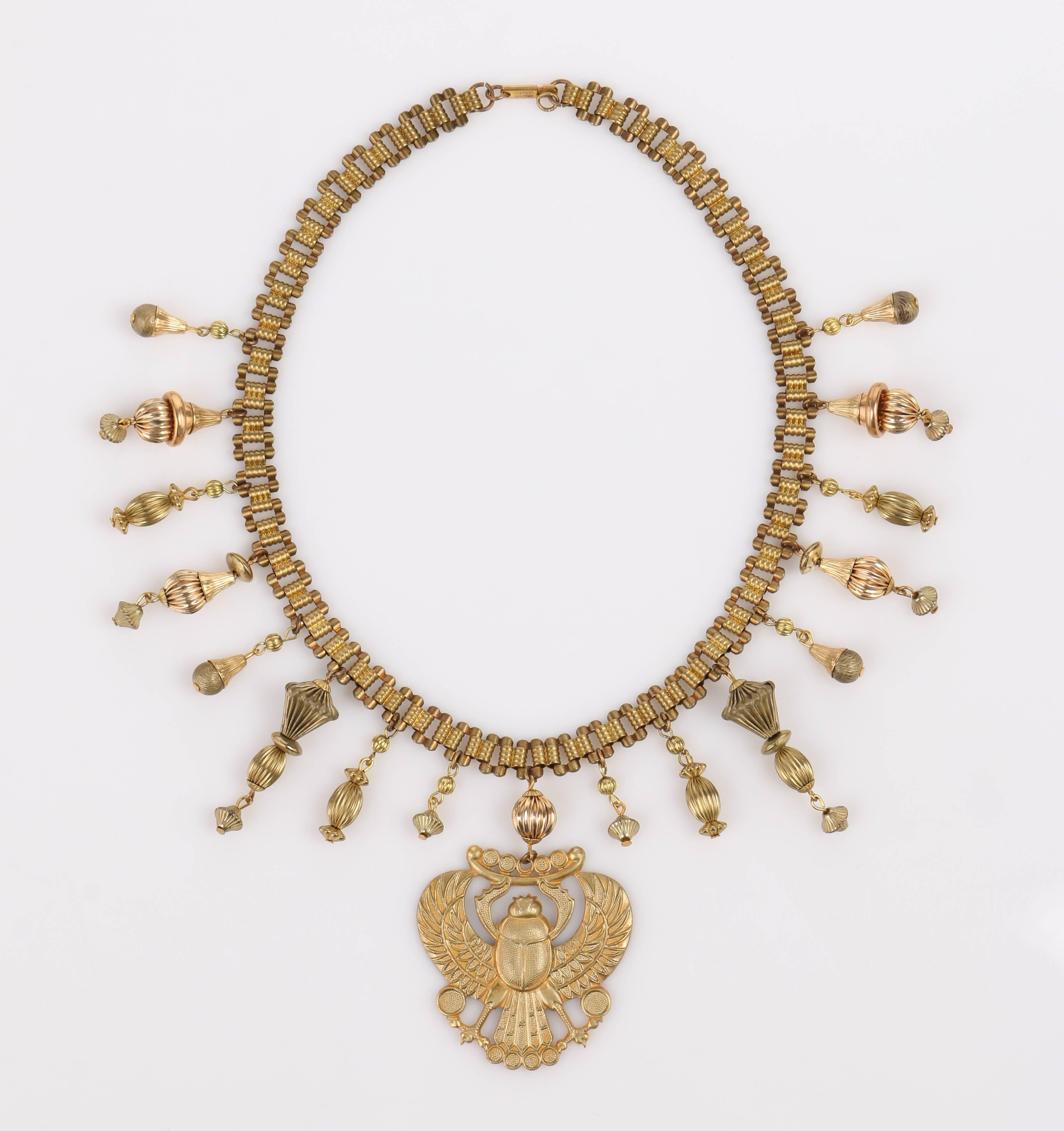 Late 1970s Miriam Haskell (signed) gold-tone winged scarab large pendant necklace. Chain is curb style with rectangular links joined with grooved connectors that look like stacked beads. Push clasp is marked 