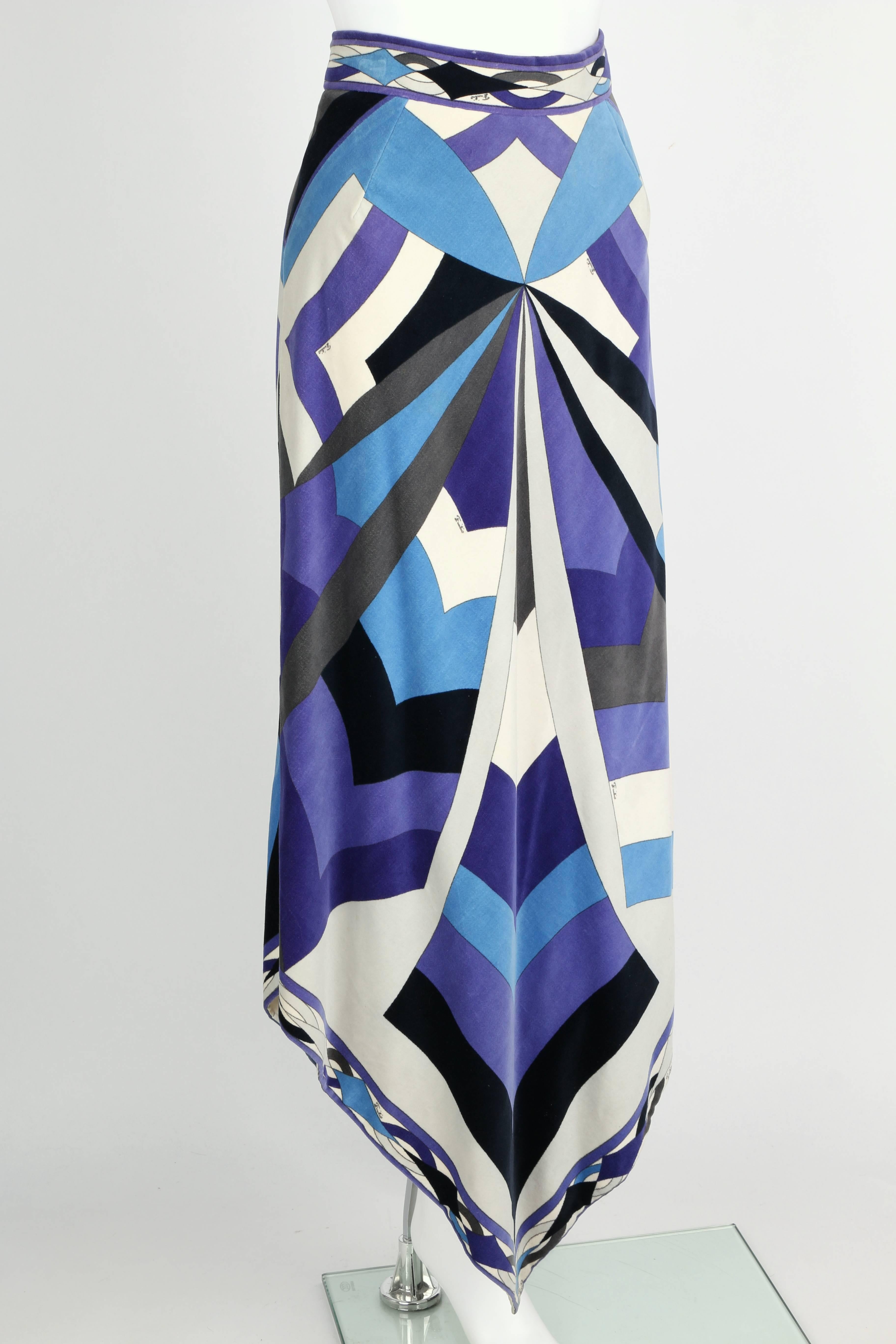 Vintage late 1960s Emilio Pucci blue, purple, gray and ivory geometric signature print velvet skirt. Scarf hemline comes to a point at the center on front and back. Skirt closes at the hip with zipper and hooks/eyes. Fully lined. Please note that