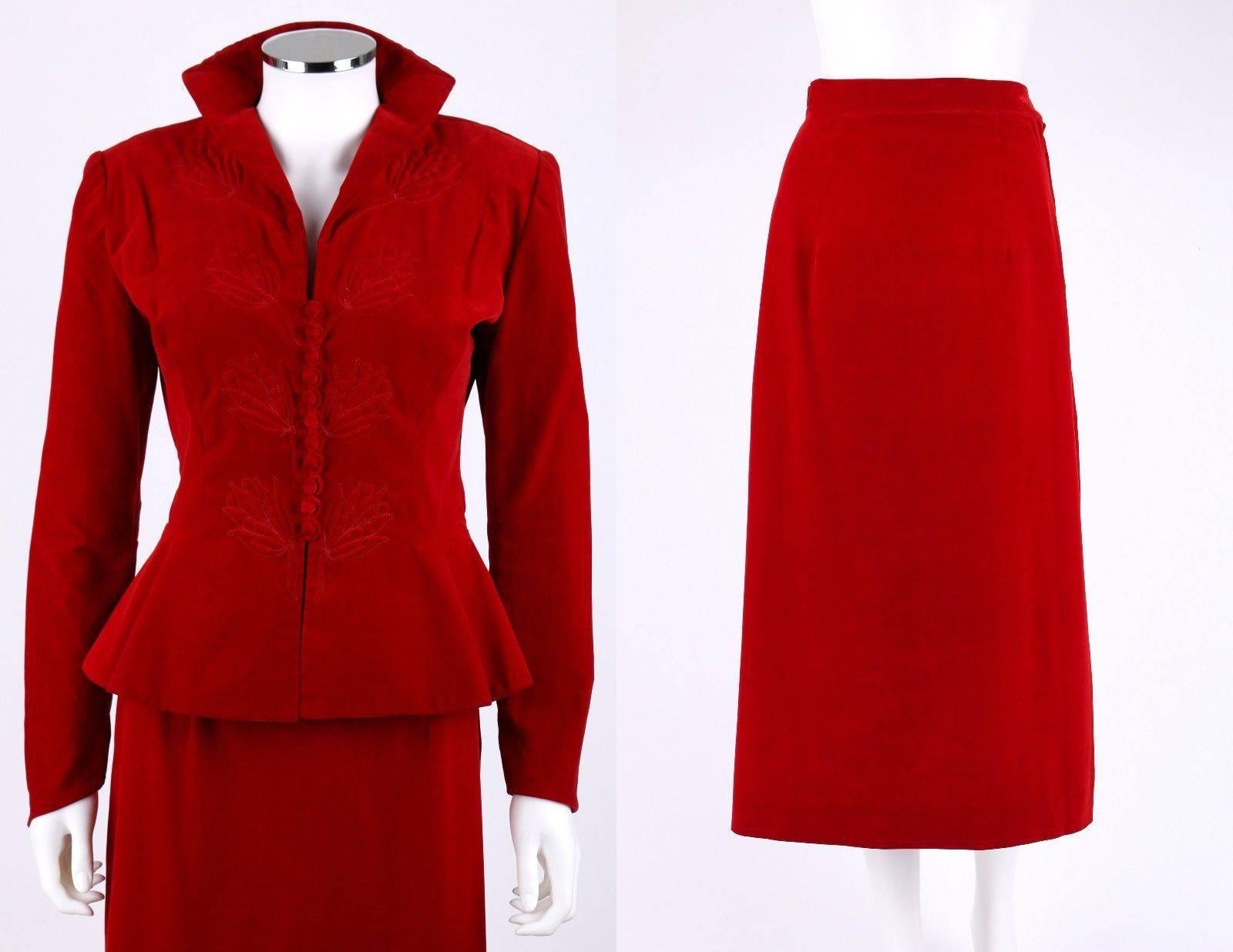 Vintage Couture late 1940s red velvet/velveteen suit. Jacket has trapunto quilted detail. Long, slightly pointed sleeves with padded shoulders. Buttons at front. Partially lined. Skirt zips and snaps at side, and has a kick pleat at center back.