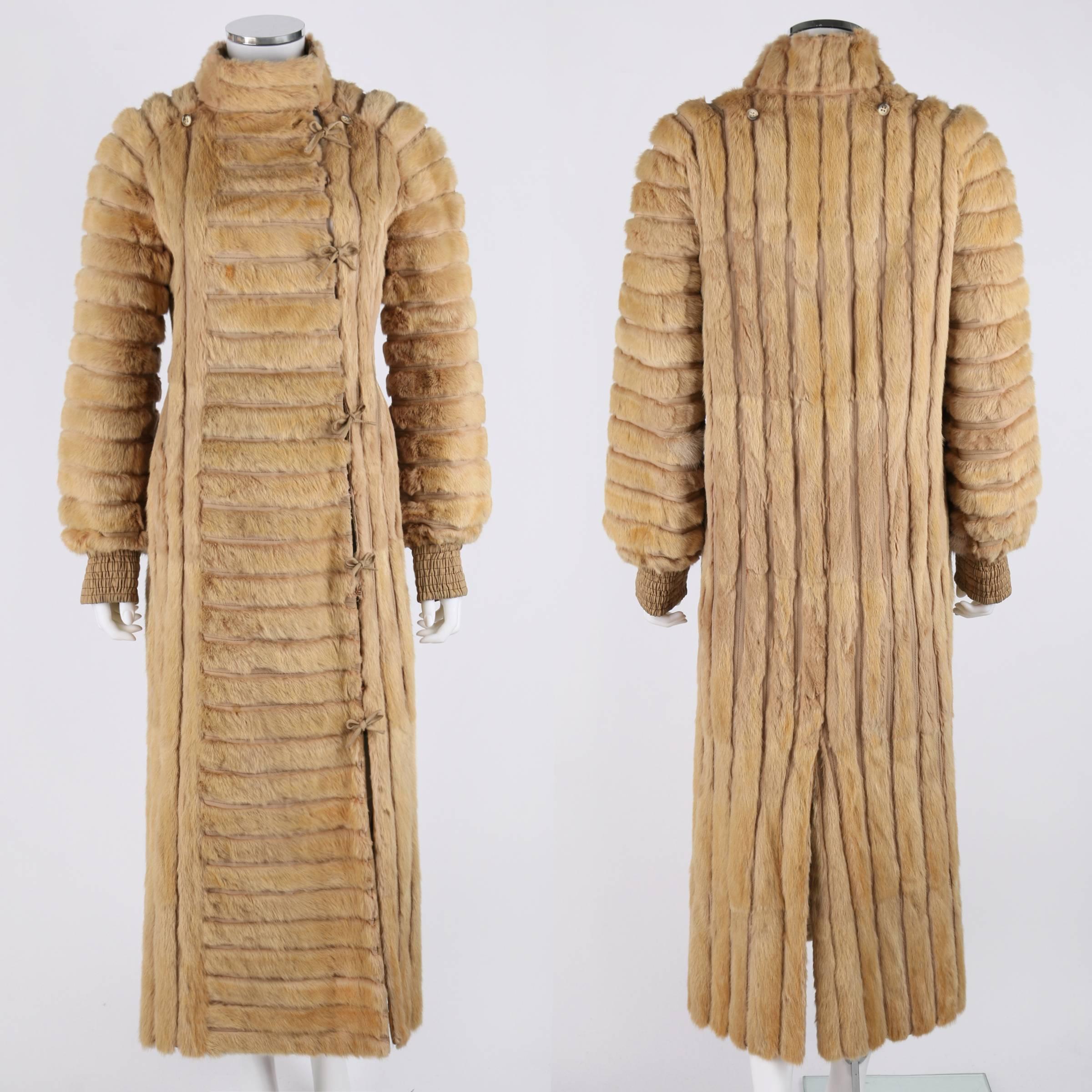 Vintage c.1970s Fendi Roma long blonde mink fur ribbed coat. Detachable hood with buttons. Long sleeves with wide elastic cuffs. Pocket on right side. Hand slit accessing interior on left side. Coat closes at front left side with hooks and ties.