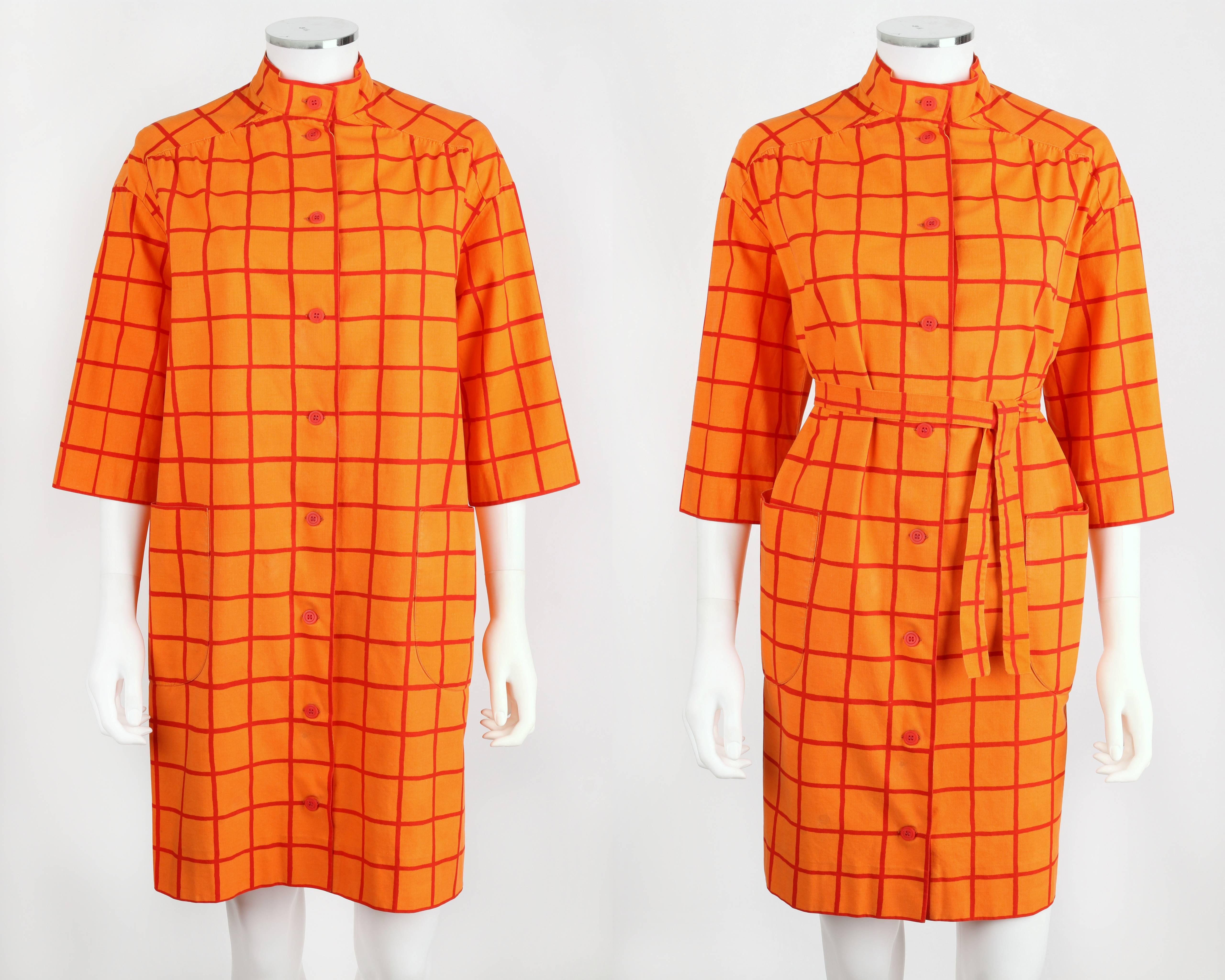 Vintage c.1960s Marimekko for Design Research orange and red window pane print cotton tent dress with tie waist belt. Mock neck. 3/4 length sleeves Two large patch pockets. Center front button closure. Unmarked Fabric Content: