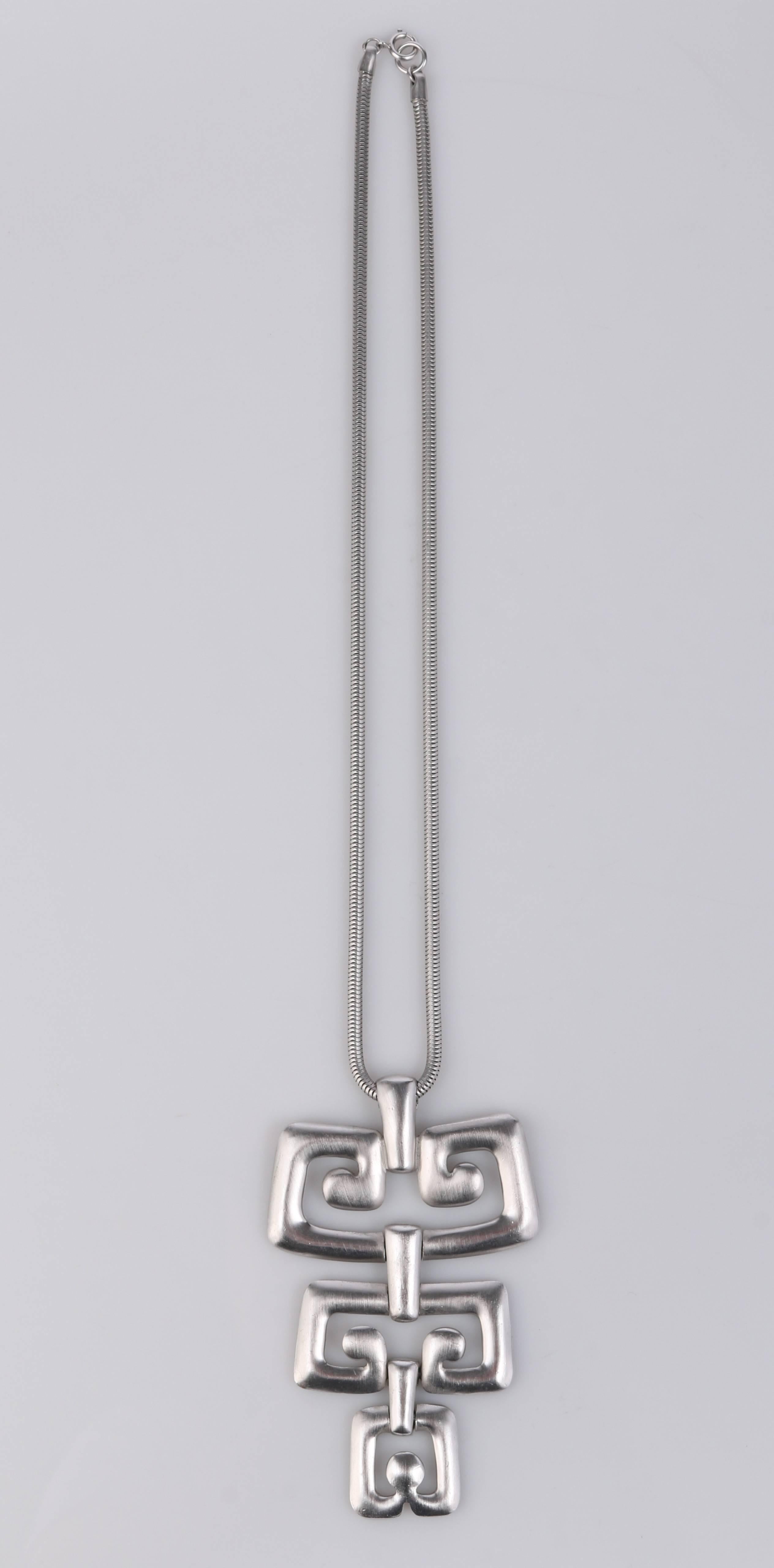 Vintage c.1970s Trifari silver tone statement, modernist, abstract, geometric, pendant on silver tone snake chain. Huge articulated geometric pendant is made of cut out brushed matte finish silver tone metal and measures approximately 4 3/4