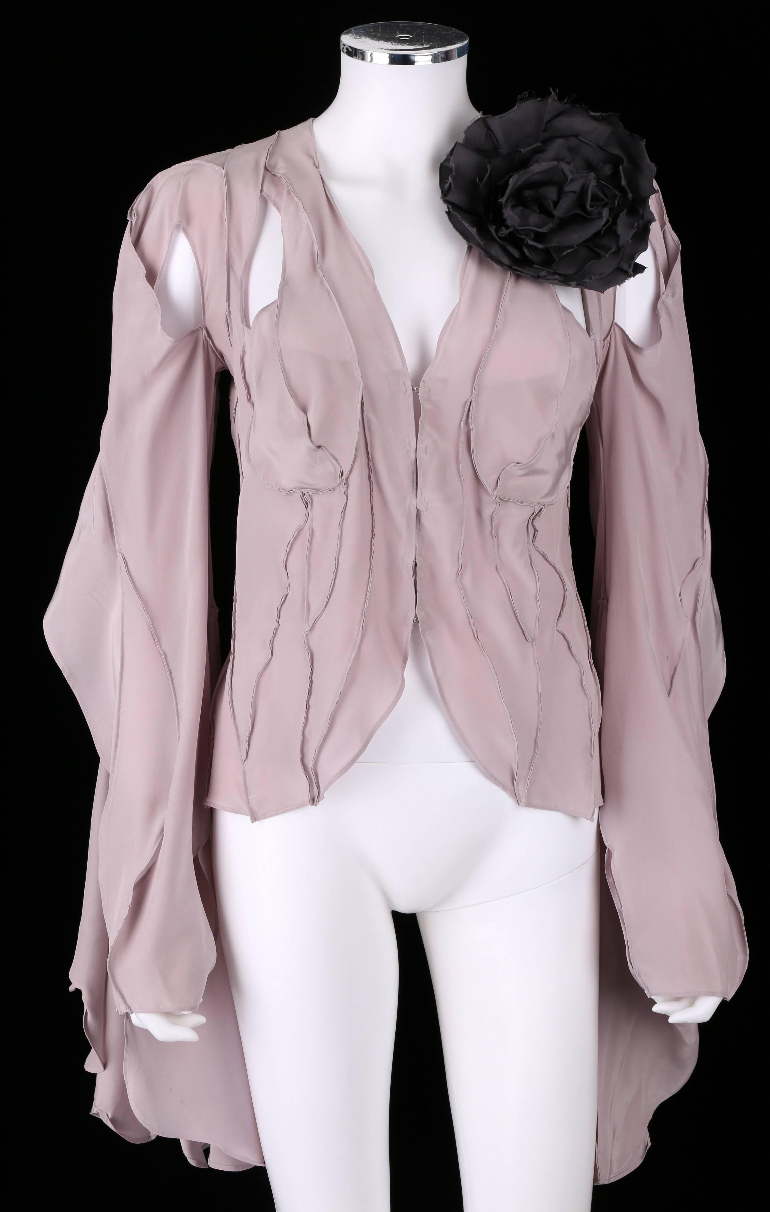 Yves Saint Laurent Spring/Summer 2003 by Tom Ford lavender silk layered deconstructed blouse. Long flowing sleeves have cutouts/open sections and button at cuff. Blouse closes at front with hooks and eyes. Large black flower brooch. Marked Fabric