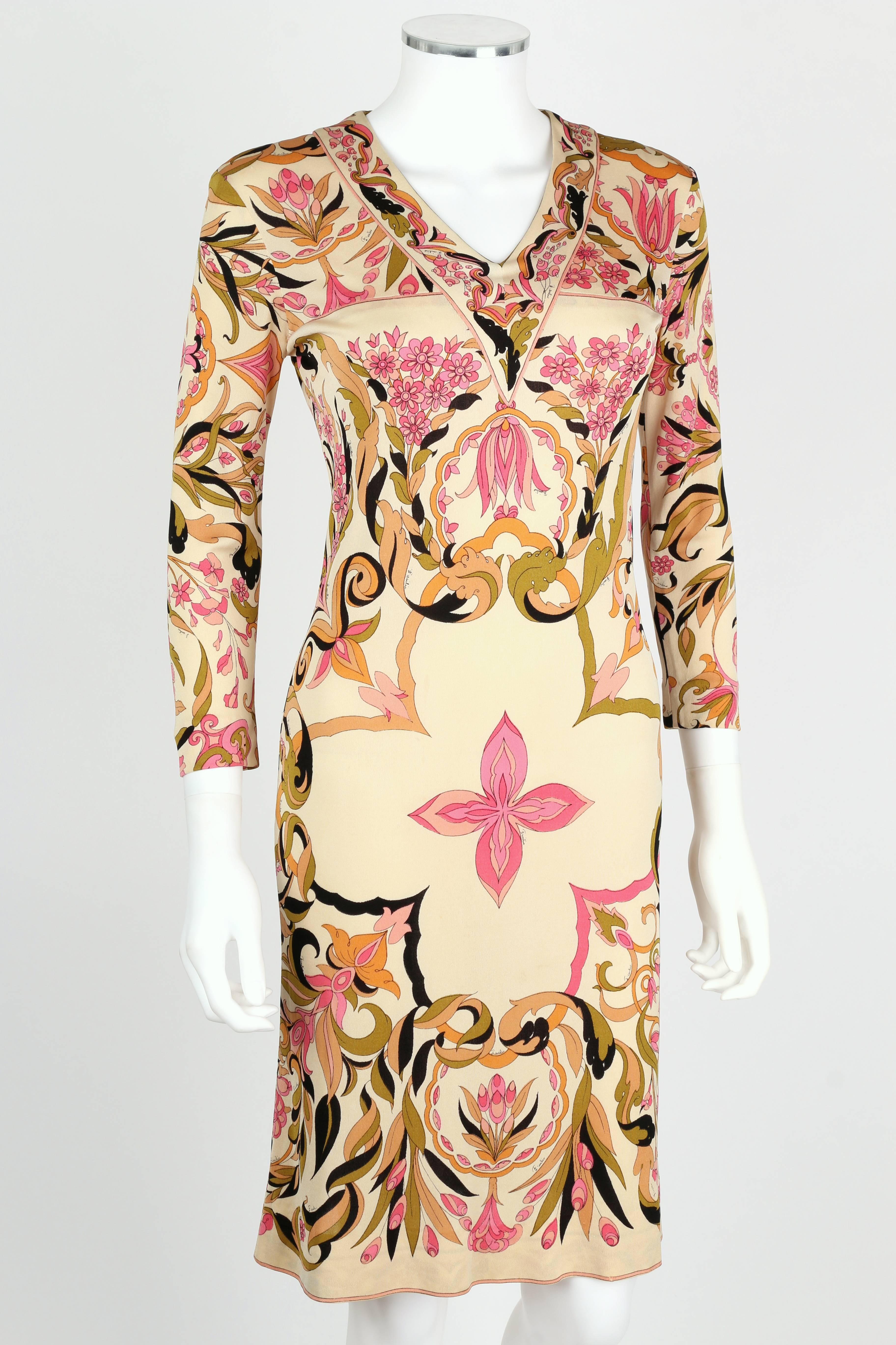 Vintage c.1960's Emilio Pucci off white silk jersey sheath dress. Kaleidoscope multicolor floral motif. V-neckline with decorative border detail. 3/4 length sleeves. Above the knee length. Slip-on style. Marked Fabric Content:  